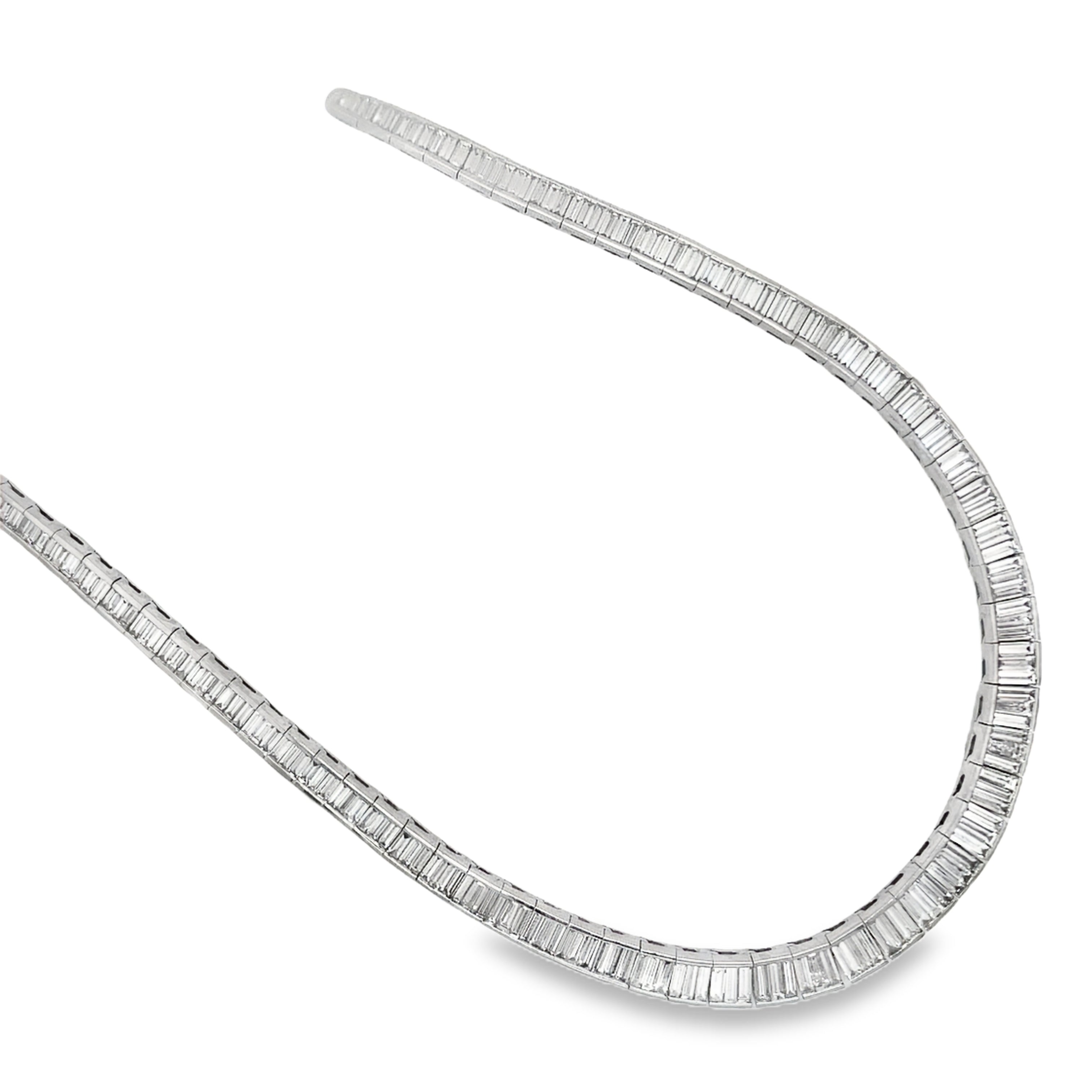 ndulge in ultimate luxury with our Graduated Baguette Diamond Necklace. Adorned with 249 dazzling diamonds totaling 24.21 carats, set in platinum, and featuring a secure hidden clasp, this 18" necklace is the epitome of elegance. Elevate any outfit with its mesmerizing sparkle and timeless sophistication.