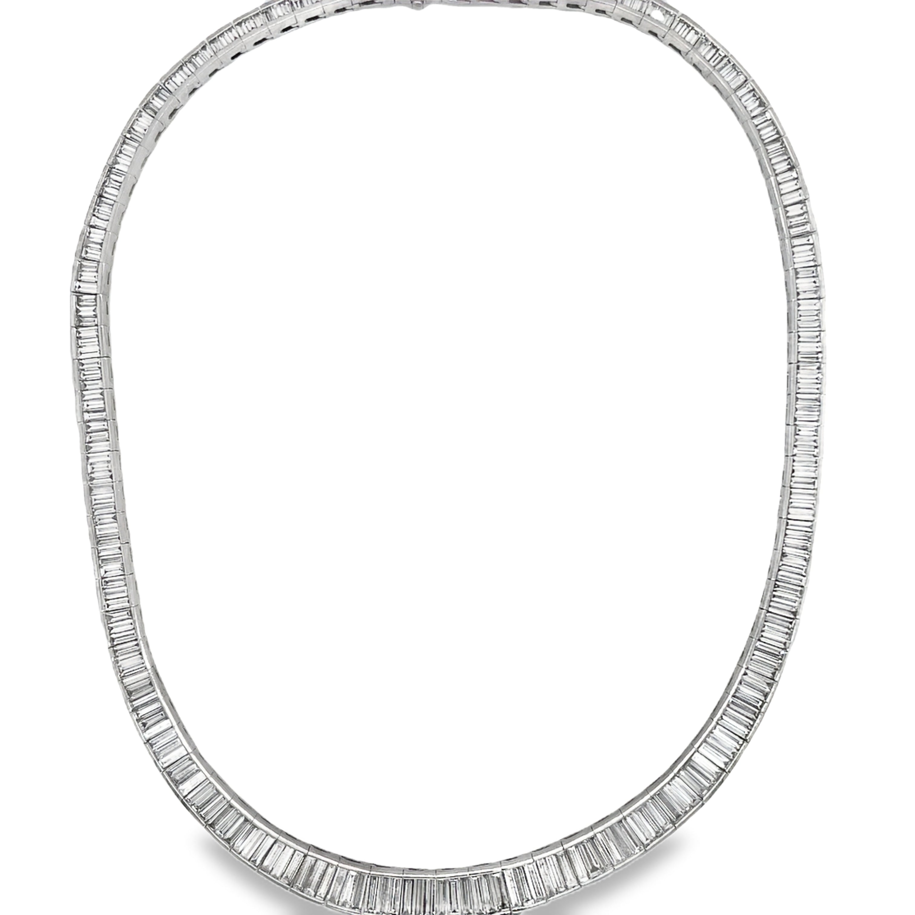 ndulge in ultimate luxury with our Graduated Baguette Diamond Necklace. Adorned with 249 dazzling diamonds totaling 24.21 carats, set in platinum, and featuring a secure hidden clasp, this 18" necklace is the epitome of elegance. Elevate any outfit with its mesmerizing sparkle and timeless sophistication.