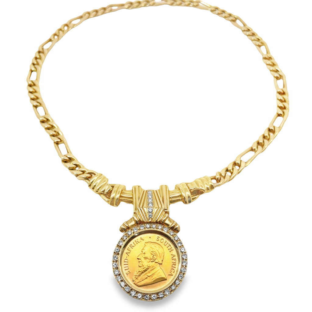 This luxurious Interchangeable Diamond Bezel Coin Pendant Yellow Gold Necklace will add sparkle and shine to whatever look you choose to wear.  Krugerrand coin is crafted 22k yellow gold set in an impressive 0.80 cts diamond bezel set and suspended from a 14k yellow figaro link chain, this magnificent piece will make you shine and stand out!