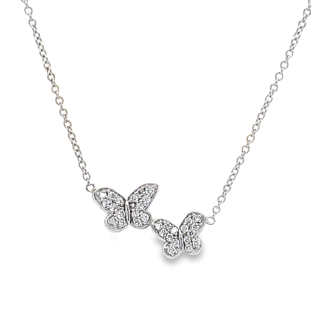 This exquisite Diamond Double Butterfly White Gold Necklace showcases your timeless style. Crafted with 14k  gold, the necklace features a double butterfly pendant with 0.25 cts of brilliant diamond accents. The secure lobster clasp and delicate white 16" chain add to its charm. Make a statement with this unique piece!