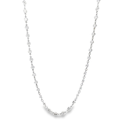 Transform any outfit into a glamorous statement with our Diamonds By the Yard Chain Necklace. Adorned with 60 round diamonds totaling 4.14 carats, this 18k white gold necklace is 18" long, providing the perfect balance of sparkle and elegance. Elevate your style with this luxurious piece.