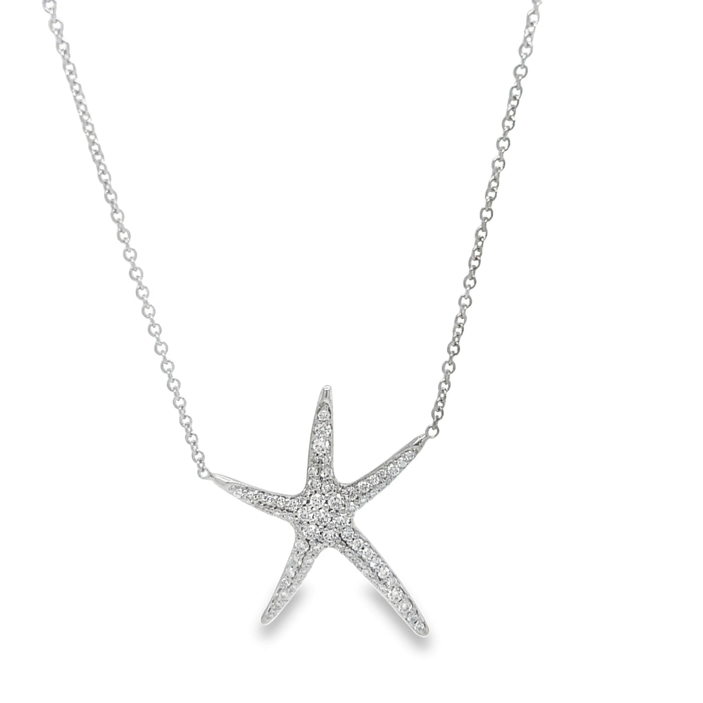 Elevate your style with our Large Diamond Starfish Pendant in 18k white gold! This stunning piece features a sparkling starfish design adorned with 0.70 cts of round diamonds. The 18" white gold chain and secure lobster clasp add the perfect touch of elegance. A must-have for any jewelry collection!