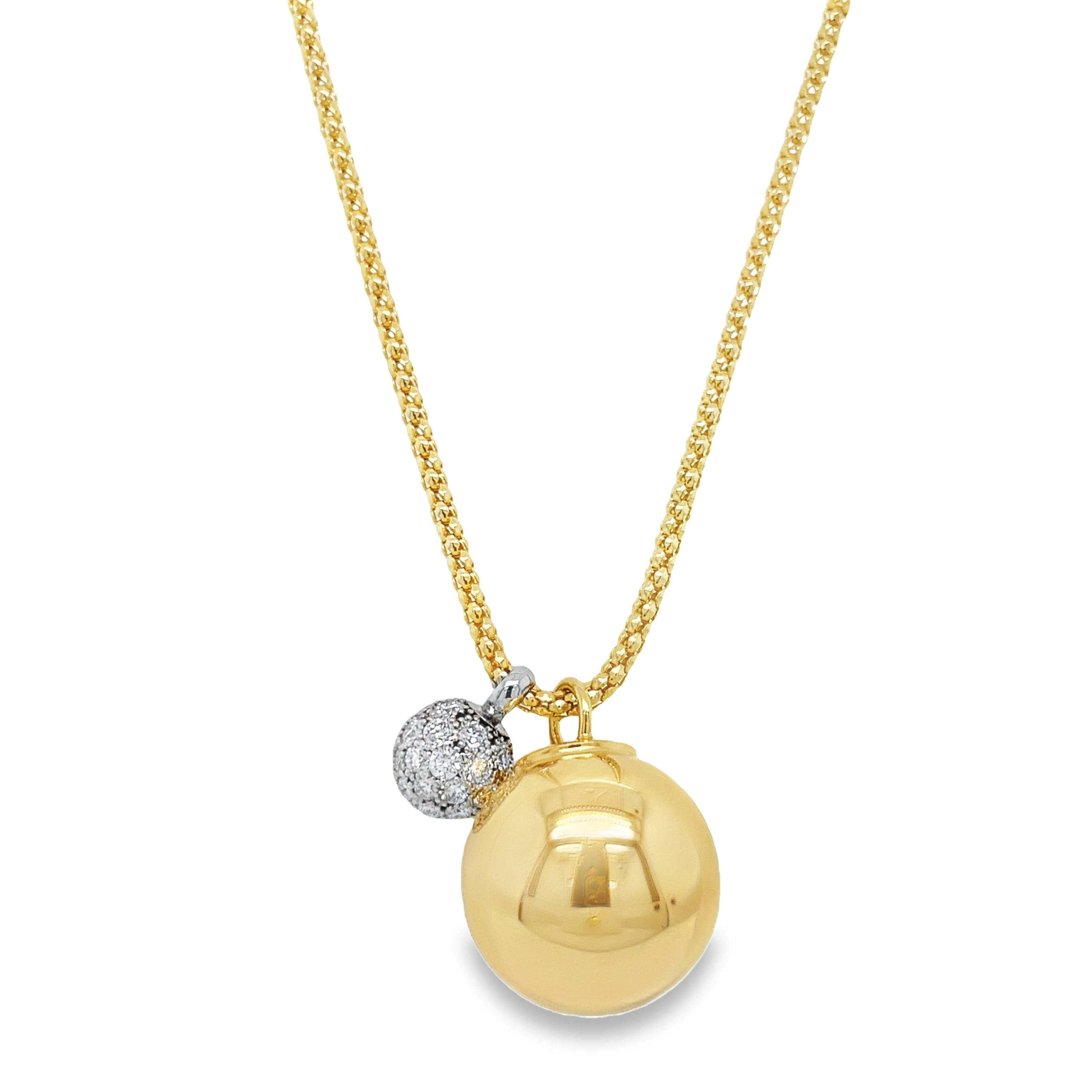Indulge in pure luxury with our Diamond Ball & Yellow Gold Sphere Mesh Necklace. Crafted with 18k yellow gold, this necklace features a stunning large gold sphere measuring 16.00 mm and a dazzling diamond pave ball totaling 1.16 cts at 8.00 mm. The 22" mesh chain is secured with a lobster clasp for a worry-free wear. Elevate any outfit with this sophisticated and elegant piece!