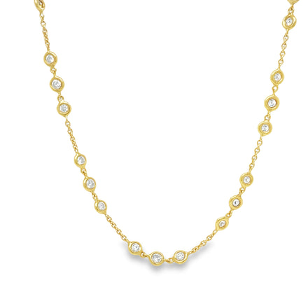 This spectacular 18k gold necklace features 2.05 carats of round diamonds, arranged in stations all around the 18" chain. With its timeless elegance and sparkling brilliance, it will make you shine. Treat yourself today!