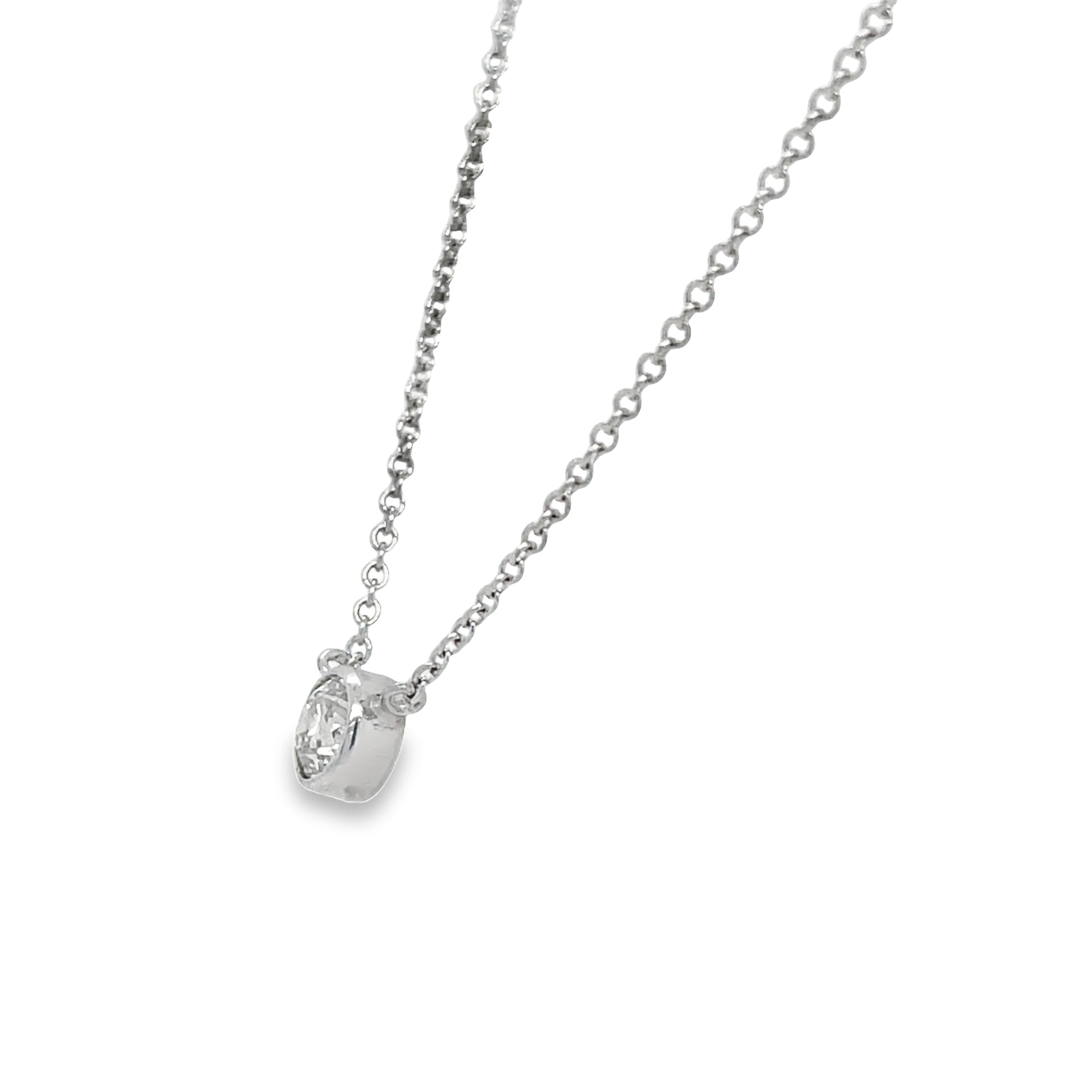 Expertly crafted with a 0.25 carat, round diamond, this 14k white gold pendant necklace is a stunning choice. The diamond is securely bezel-set, ensuring optimal shine and brilliance. In addition, its color grade of H and clarity grade of SI-1 promise a high-quality, sparkling accessory.