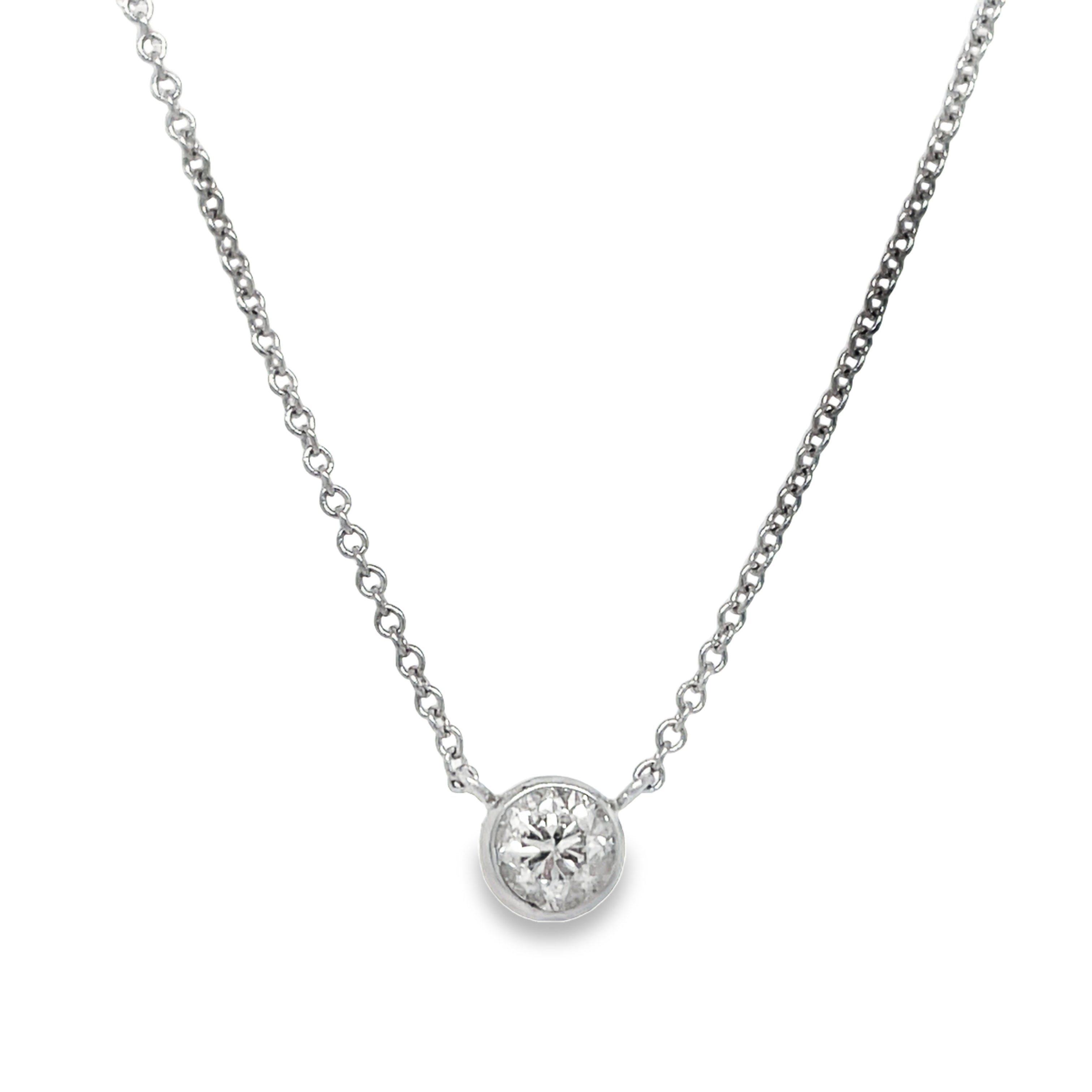 Expertly crafted with a 0.25 carat, round diamond, this 14k white gold pendant necklace is a stunning choice. The diamond is securely bezel-set, ensuring optimal shine and brilliance. In addition, its color grade of H and clarity grade of SI-1 promise a high-quality, sparkling accessory.