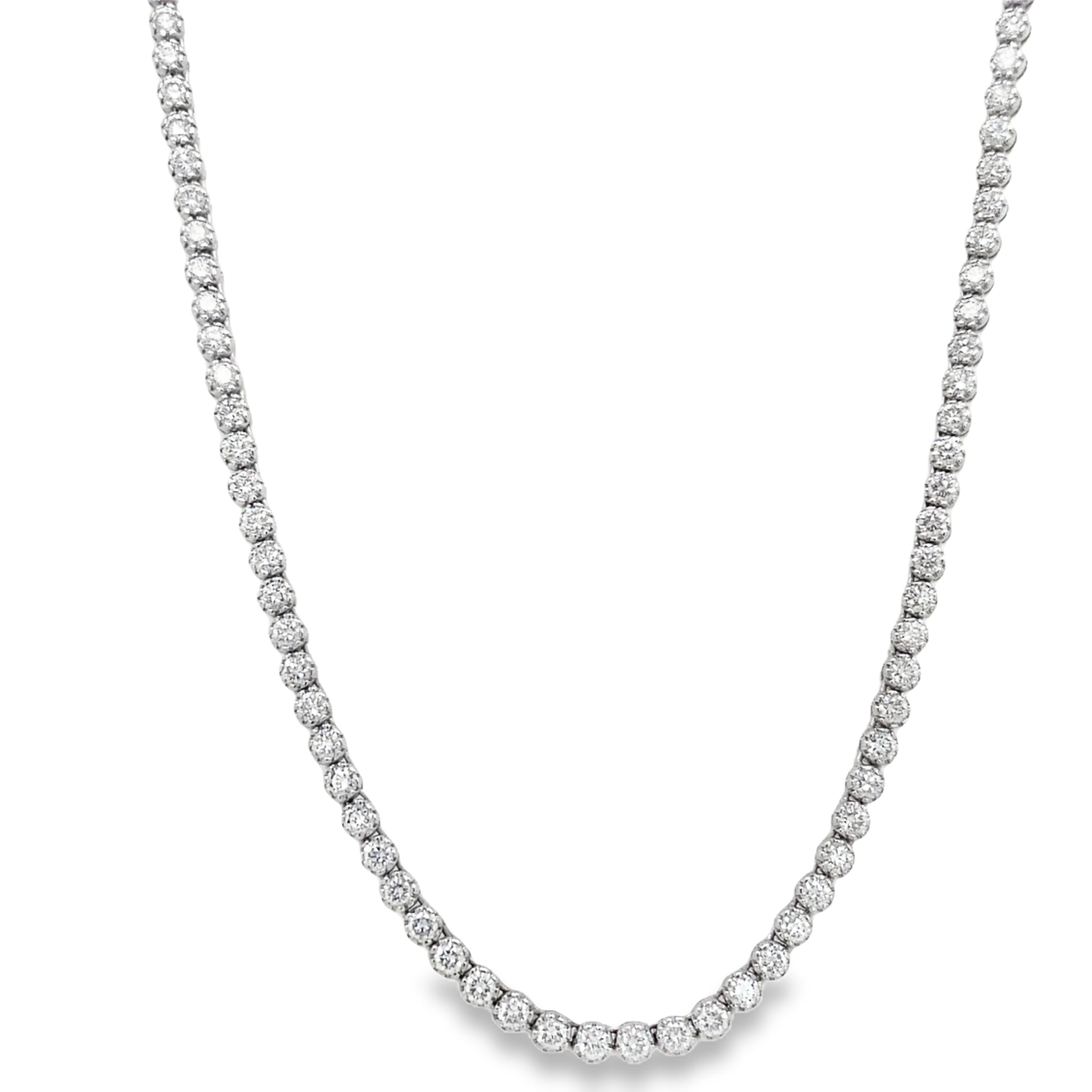 Elevate your look with our exquisite Diamond Tennis Necklace. Crafted in 18k white gold, this tennis line necklace boasts 8.00 cts of sparkling diamonds. The hidden clasp and figure 8 design provide a secure fit, while the E/F color and VS1 clarity ensure unparalleled beauty. Indulge in luxury.