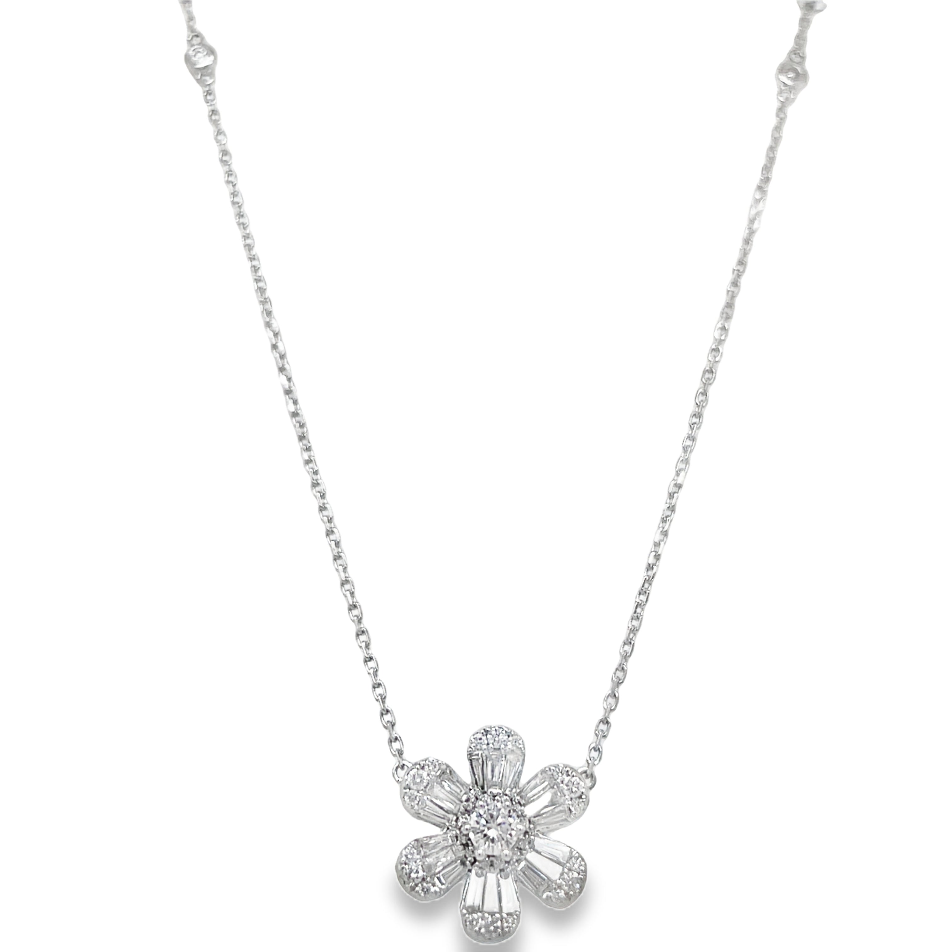 Experience effortless elegance with our Six Petal Baguette &amp; Round Diamond Flower Motif Pendant Necklace. Made of 18k white gold, it features a stunning arrangement of round and baguette diamonds totaling 0.84 cts with F/G color. The hidden bail adds a touch of sophistication.&nbsp; Two round diamond bezel set to adorn the pendant&nbsp;