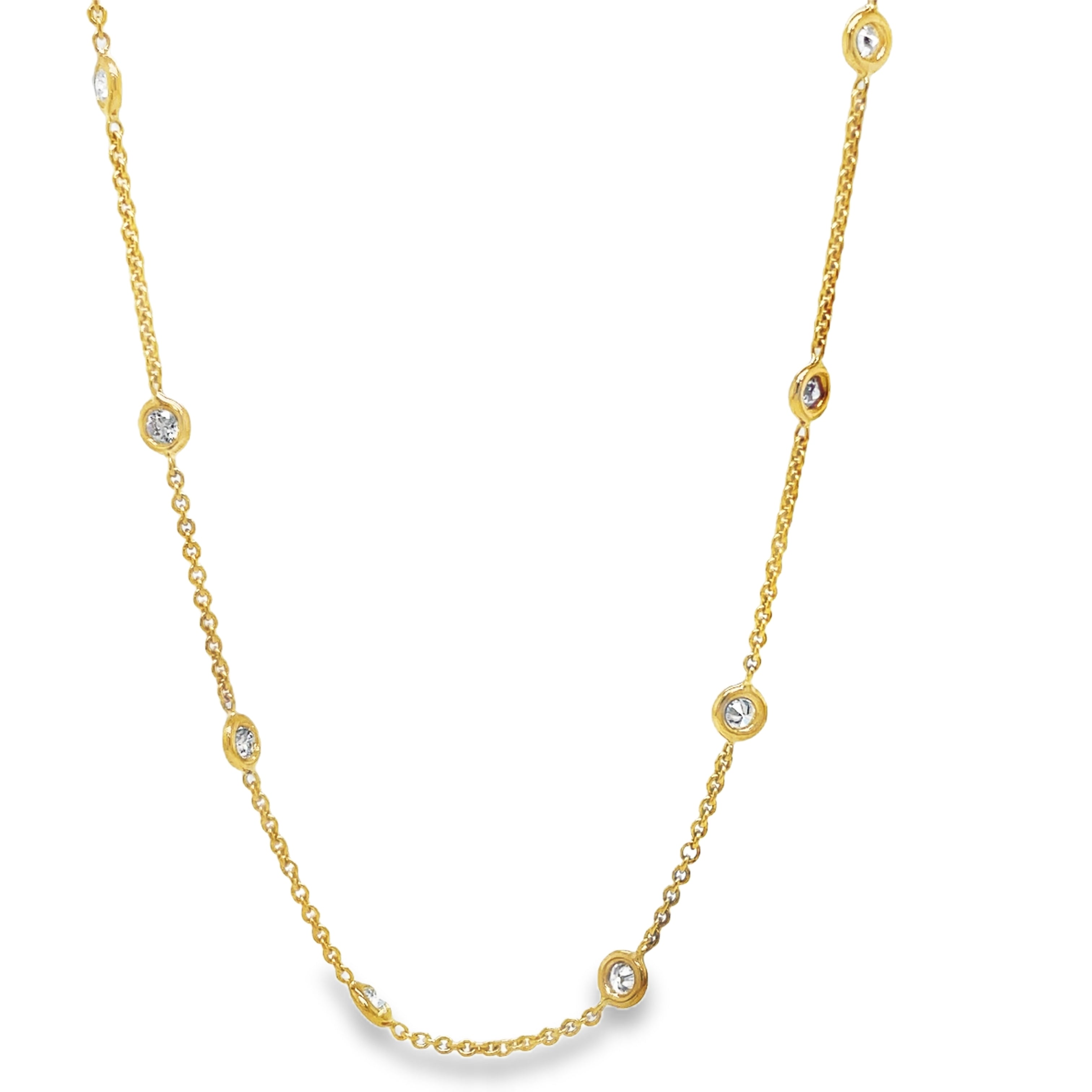 Indulge in the timeless elegance of our Diamond by the Yard Necklace. Adorned with a 12 brilliant 1.00 carat round diamond total securely bezel set in 18k yellow gold, this necklace exudes luxury and sophistication. The 18" chain is finished with a secure lobster catch, making it the perfect addition to any outfit. Elevate your style with this stunning piece today!