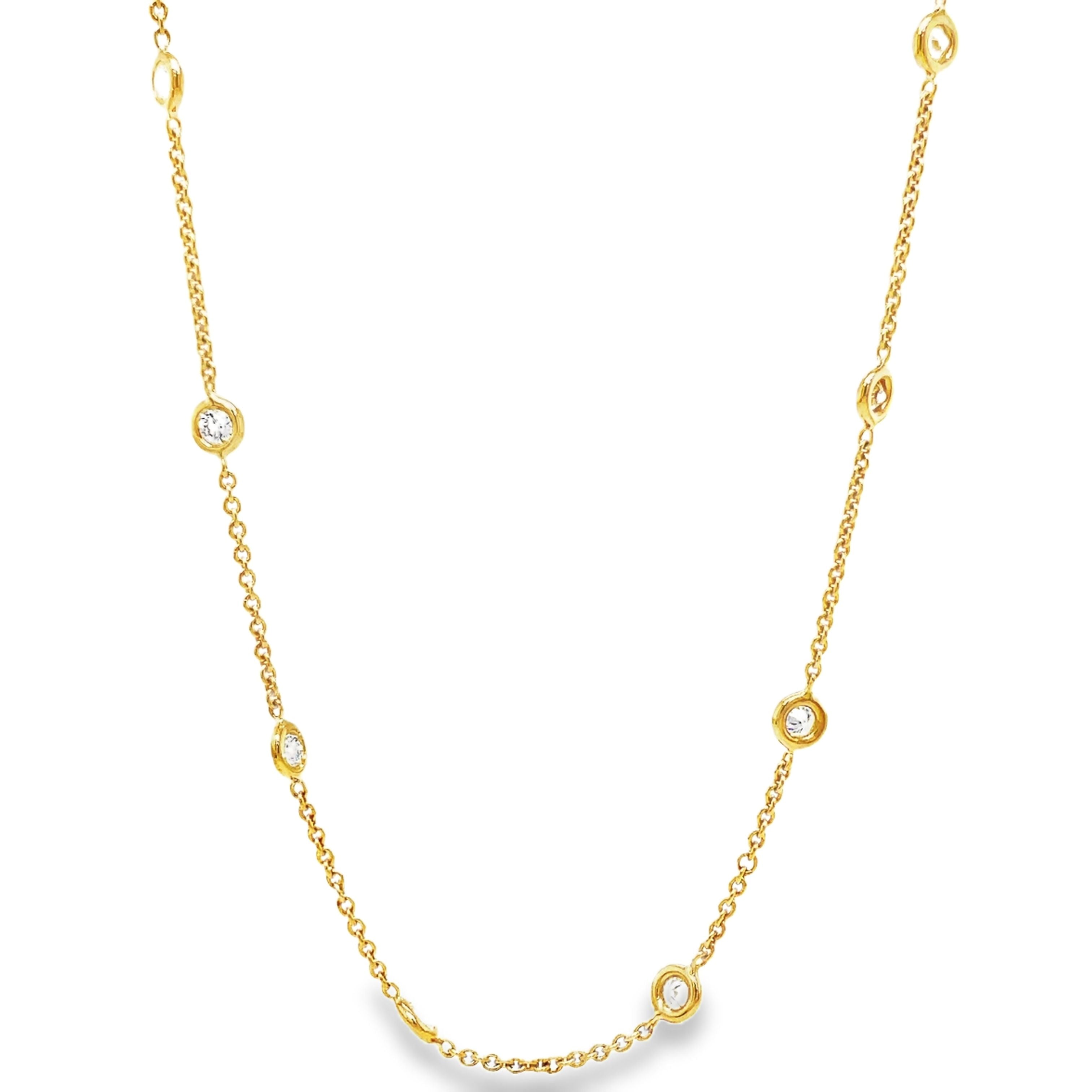 Indulge in the timeless elegance of our Diamond by the Yard Necklace. Adorned with a 12 brilliant 1.00 carat round diamond total securely bezel set in 18k yellow gold, this necklace exudes luxury and sophistication. The 18" chain is finished with a secure lobster catch, making it the perfect addition to any outfit. Elevate your style with this stunning piece today!