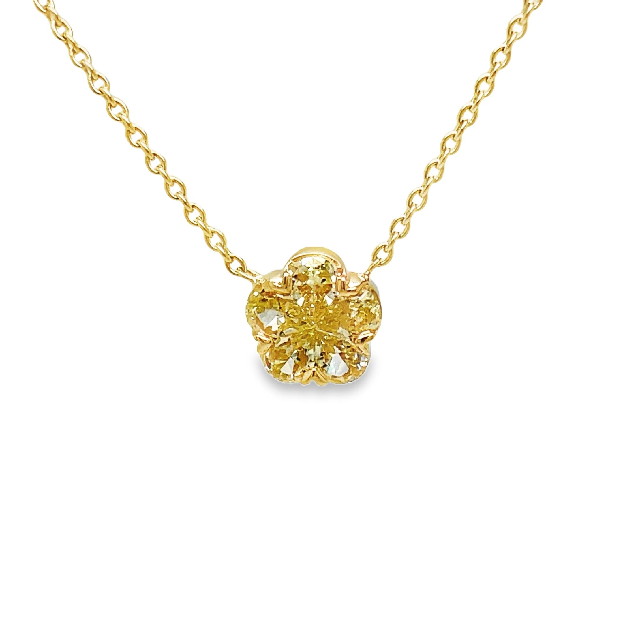 Elevate your style with our Fancy Yellow Diamond Flower Pendant Necklace. This exquisite piece features 0.66 cts of fancy yellow diamonds set in a delicate flower motif, all crafted in 18k yellow gold. Add a touch of luxury to any outfit with this stunning pendant necklace.