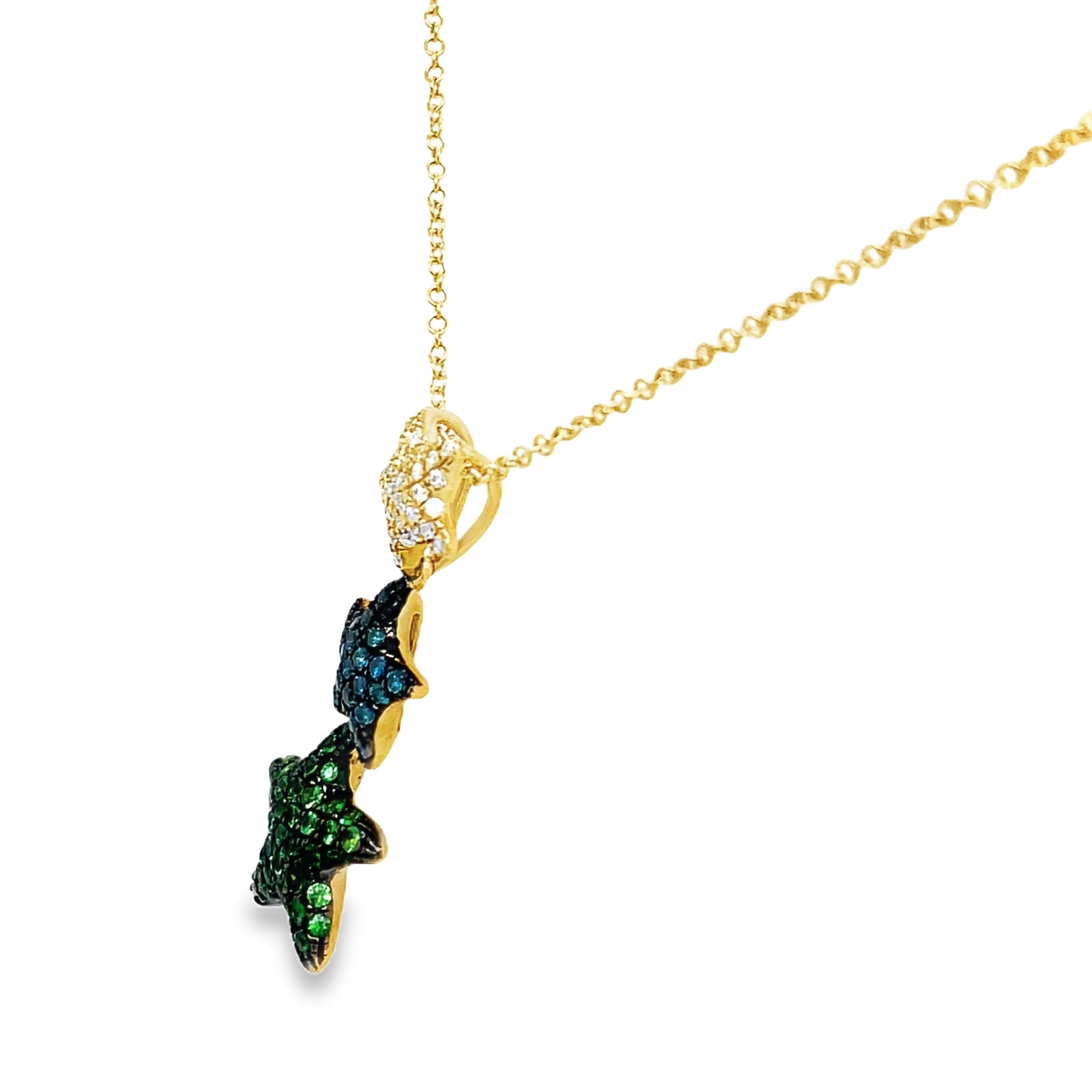 Indulge in luxury with our Triple Starfish Necklace. Crafted with three delicate starfish pendants, this necklace features tsavorite yellow gold and dazzling diamonds. Elevate your style with this exclusive piece that will surely make a statement wherever you go.