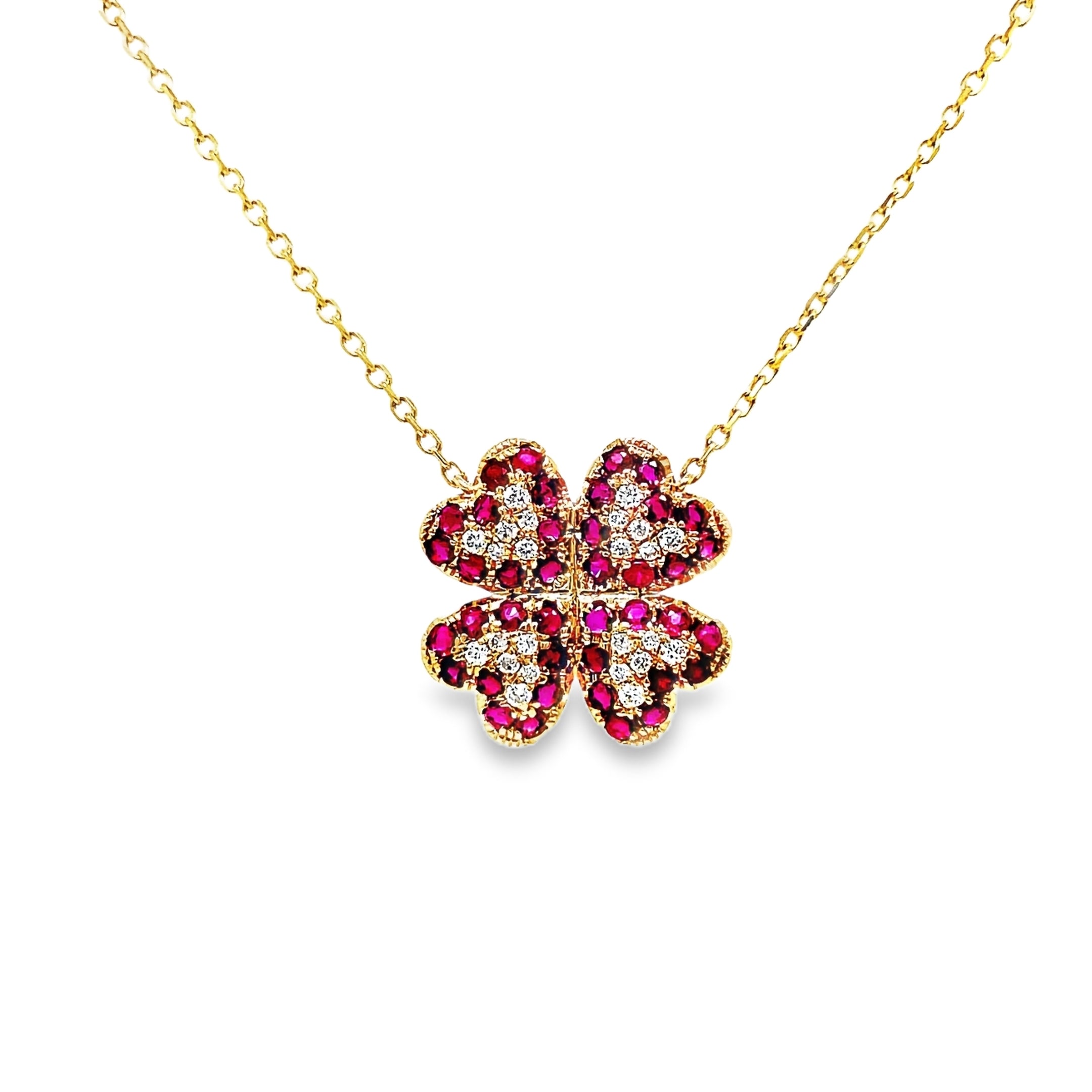 Exude elegance with our Four Petal Ruby and Diamond Pendant Necklace. Adorned with stunning round rubies totaling 0.95 cts and shimmering round diamonds totaling 0.16 cts, this 14k yellow gold necklace boasts a sophisticated four petal flower design. Elevate your style and make a statement with this exclusive piece.