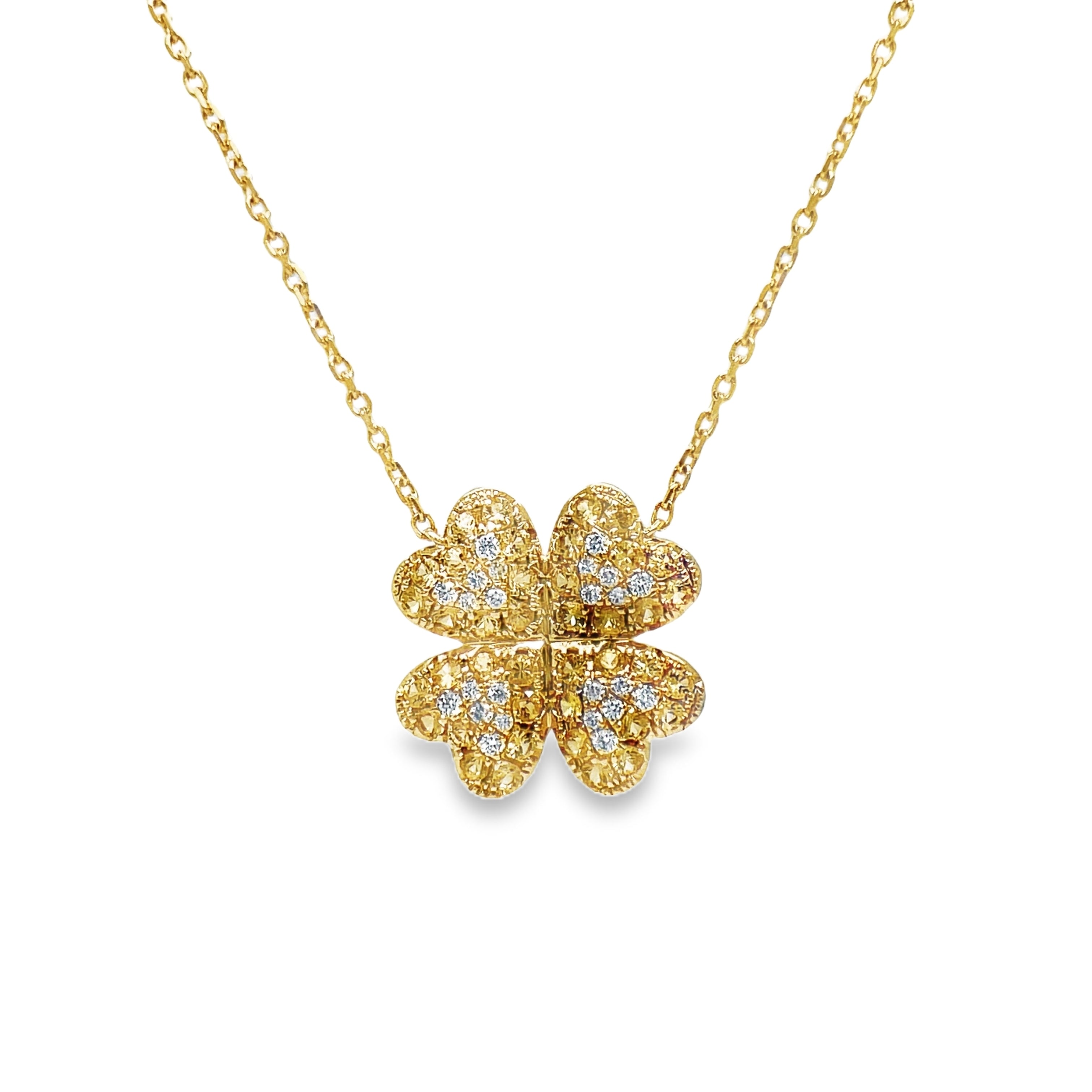 Indulge in the luxurious sophistication of our Four Petal Yellow Sapphire &amp; Diamond Pendant Necklace. Crafted with 14k yellow gold and adorned with 0.86 carats of vibrant yellow sapphires and 0.16 carats of dazzling round diamonds. Complete with a 18" chain and sizing loop at 16", this necklace is the perfect addition to any elegant ensemble.