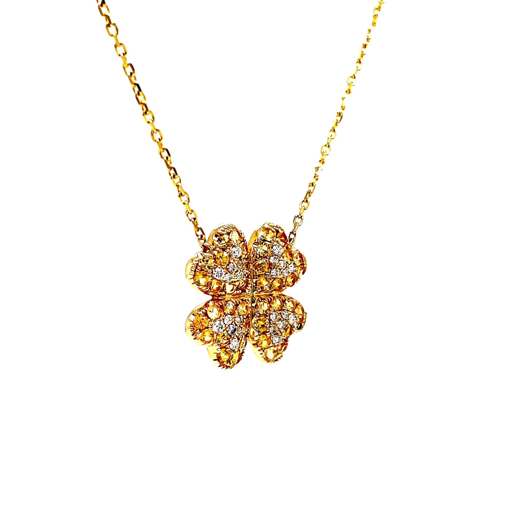 Indulge in the luxurious sophistication of our Four Petal Yellow Sapphire &amp; Diamond Pendant Necklace. Crafted with 14k yellow gold and adorned with 0.86 carats of vibrant yellow sapphires and 0.16 carats of dazzling round diamonds. Complete with a 18" chain and sizing loop at 16", this necklace is the perfect addition to any elegant ensemble.