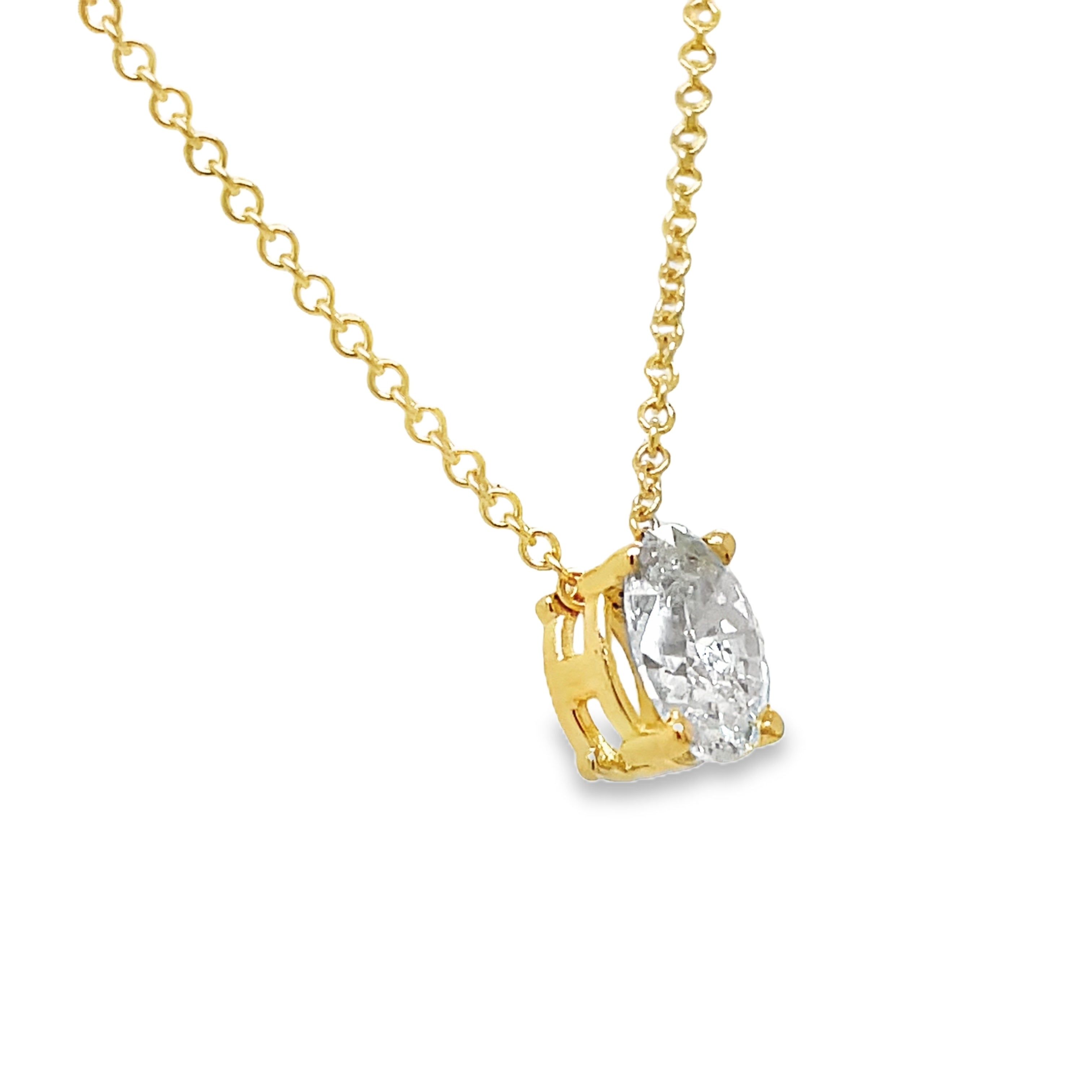 Indulge in understated luxury with our Oval Cut Diamond Solitaire Yellow Gold Necklace. The 1.20 carat oval cut diamond is elegantly set in a secure prong setting, suspended on a 16" yellow gold chain. Perfect for any occasion, this necklace exudes sophistication and grace.