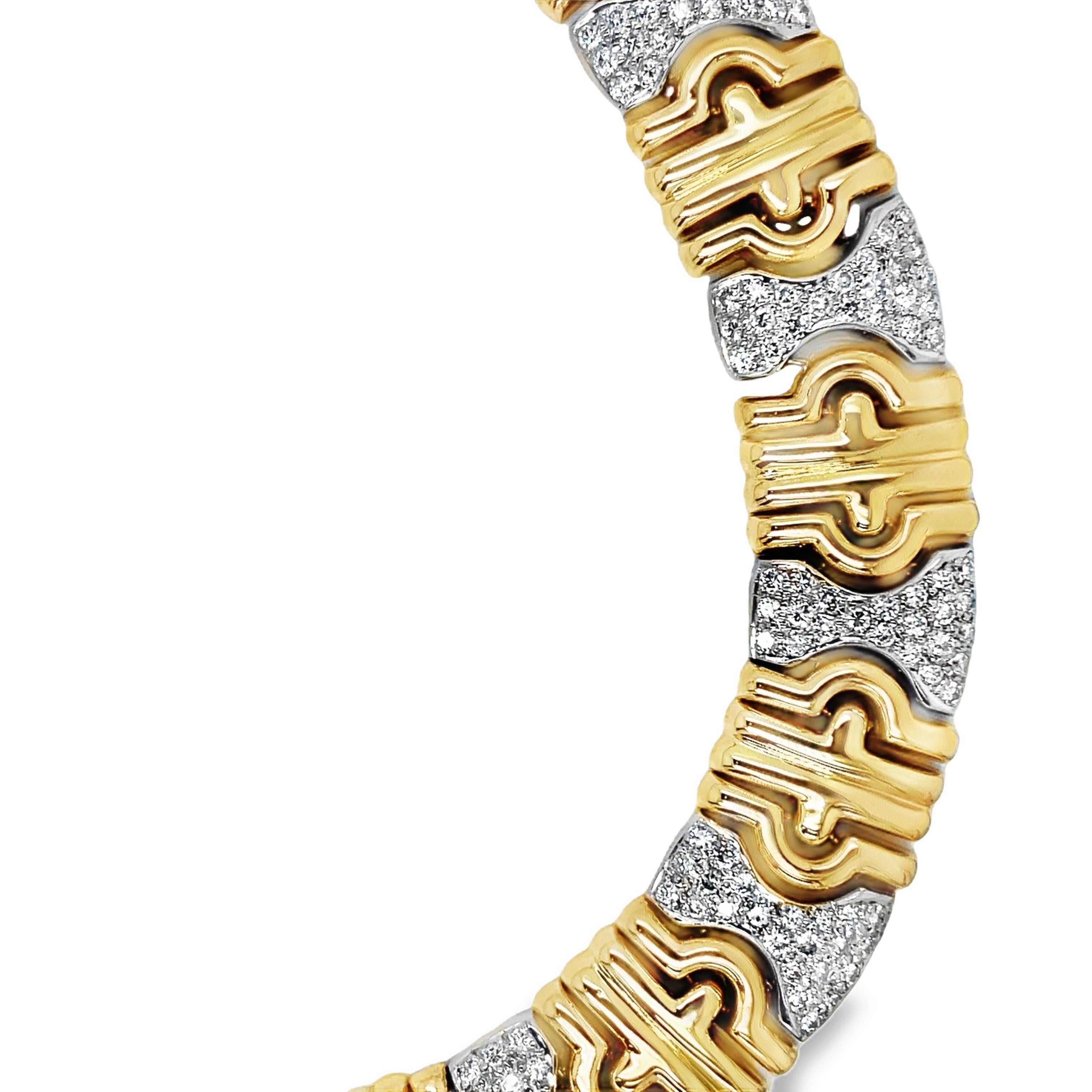 Indulge in the luxurious elegance of our Estate Yellow and White Diamond Parentesi Link Necklace. Made with 14k yellow gold and shimmering round diamonds, this 17" necklace boasts 4.50 cts of stunning sparkle. Elevate any outfit with this exclusive and sophisticated piece, a true treasure for the discerning buyer. Made is Italy