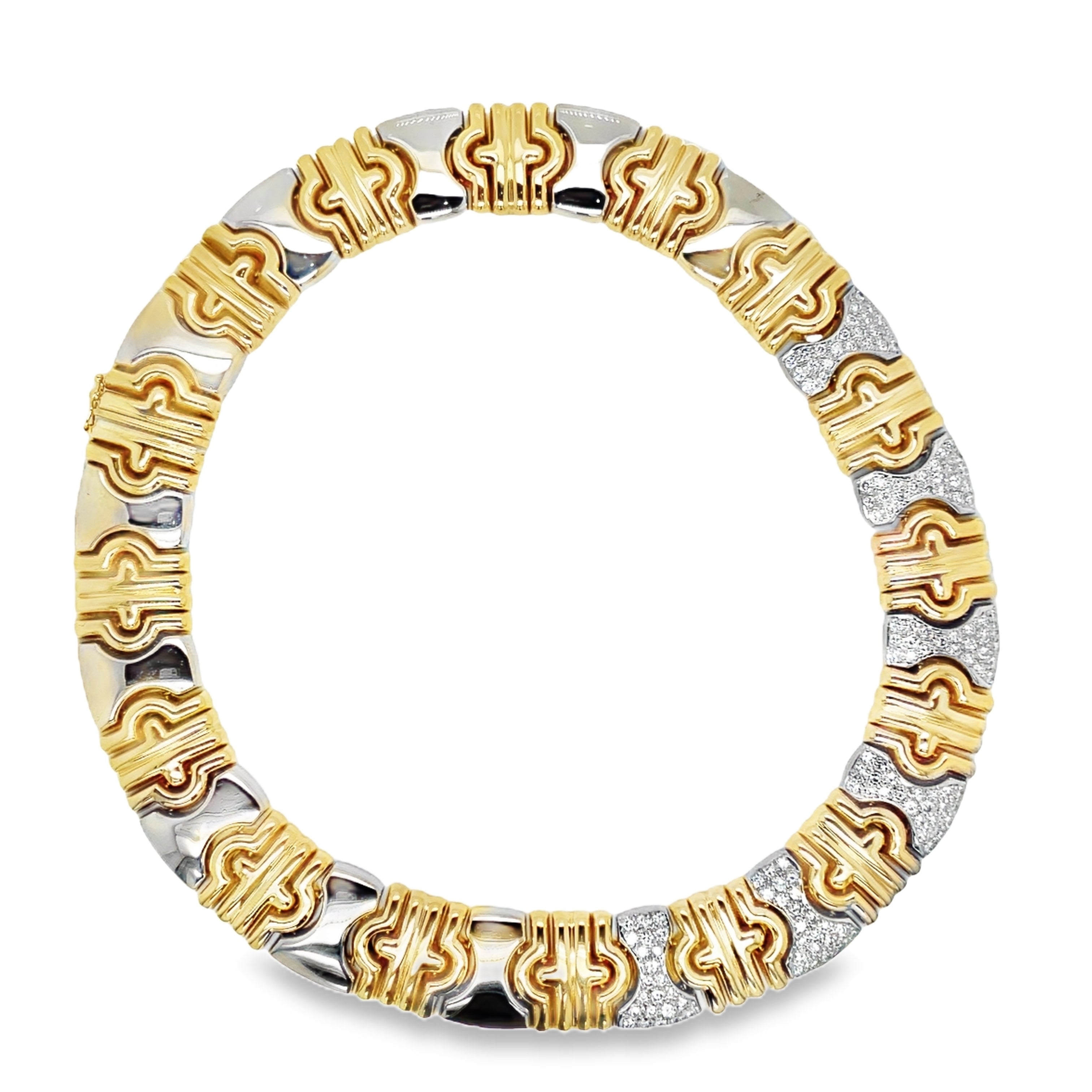 Indulge in the luxurious elegance of our Estate Yellow and White Diamond Parentesi Link Necklace. Made with 14k yellow gold and shimmering round diamonds, this 17" necklace boasts 4.50 cts of stunning sparkle. Elevate any outfit with this exclusive and sophisticated piece, a true treasure for the discerning buyer. Made is Italy