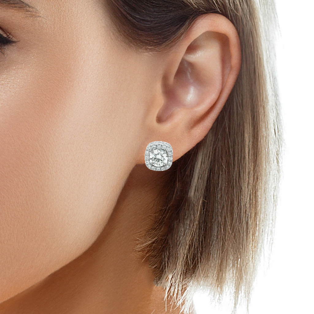 Marvel in the majestic beauty of these 14k white gold earring jacketss. Their bold 11.00 x 11.00 mm square shape is accentuated with F/G grade round diamonds that twinkle with 0.66 cts. The diamond square removable jackets are a must-have addition to your jewelry collection! (Diamond studs not included.)