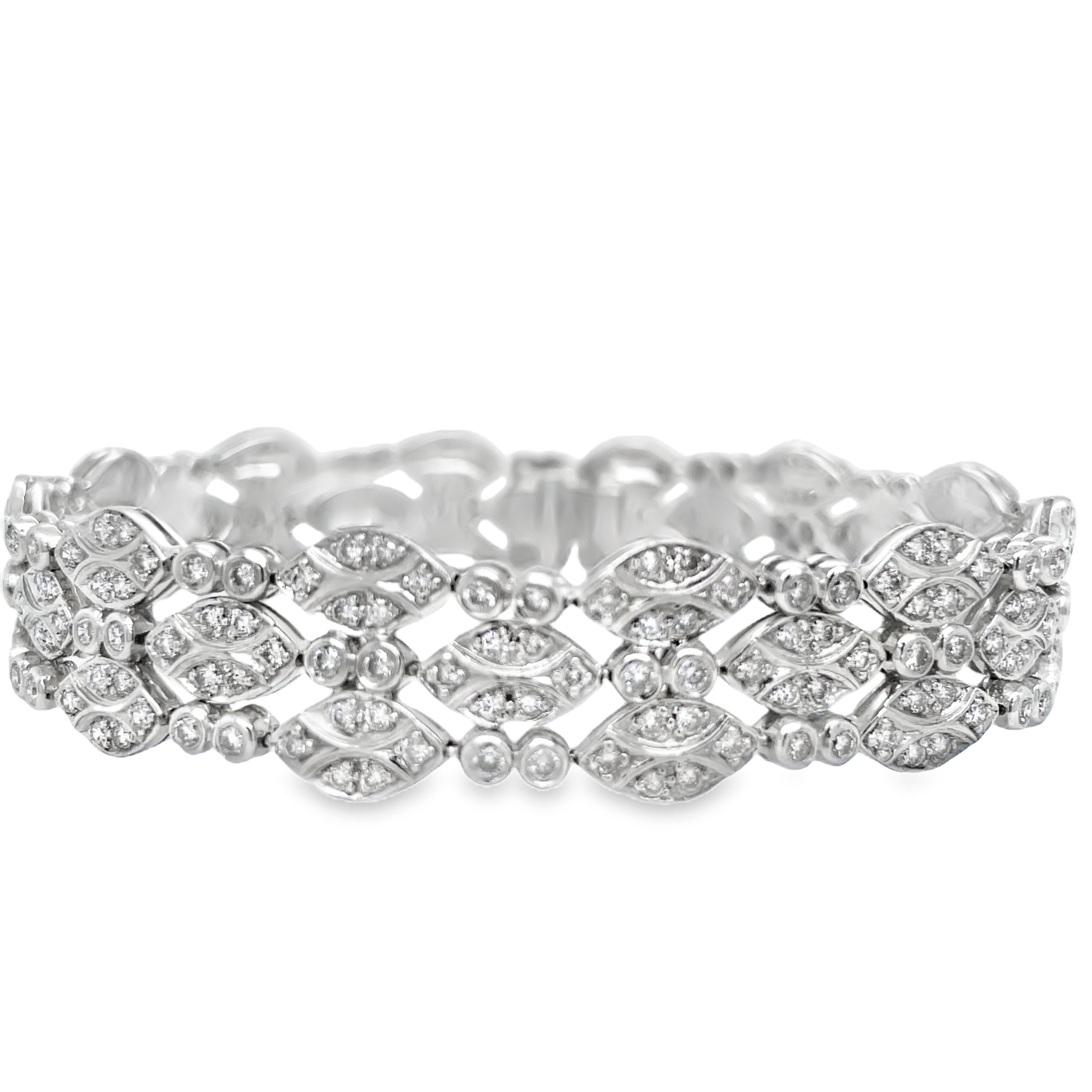 ndulge in elegance with our Diamond Pave Set Link Bracelet. Made with platinum and adorned with round diamonds totaling 4.15 cts, each diamond pave link sparkles with sophistication. With a hidden clasp and 7" length, this bracelet is the epitome of luxury. Elevate your style today.