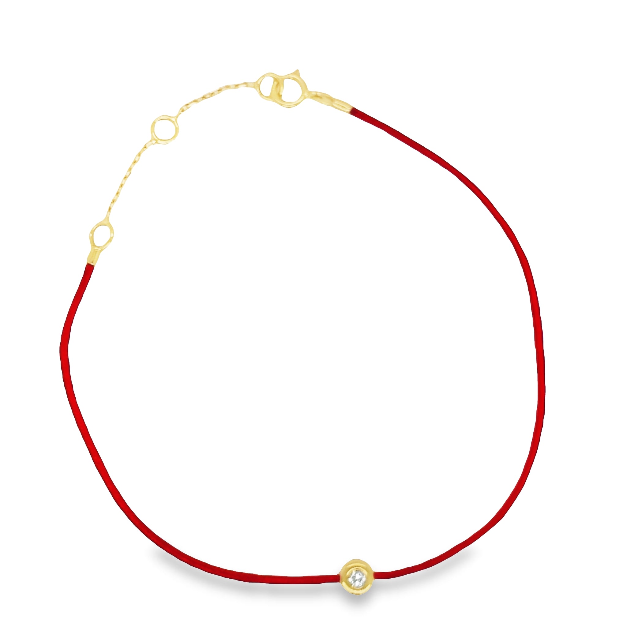 Indulge in the luxurious sparkle of this Dainty Diamond Solitaire Red Silk Bracelet. Boasting a single bezel-set diamond set in 18K golden yellow gold, this adjustable bracelet creates an unforgettable look. The adjustable silk cord ensures a perfect fit every time. Enjoy the shimmer and shine of this lavish piece.