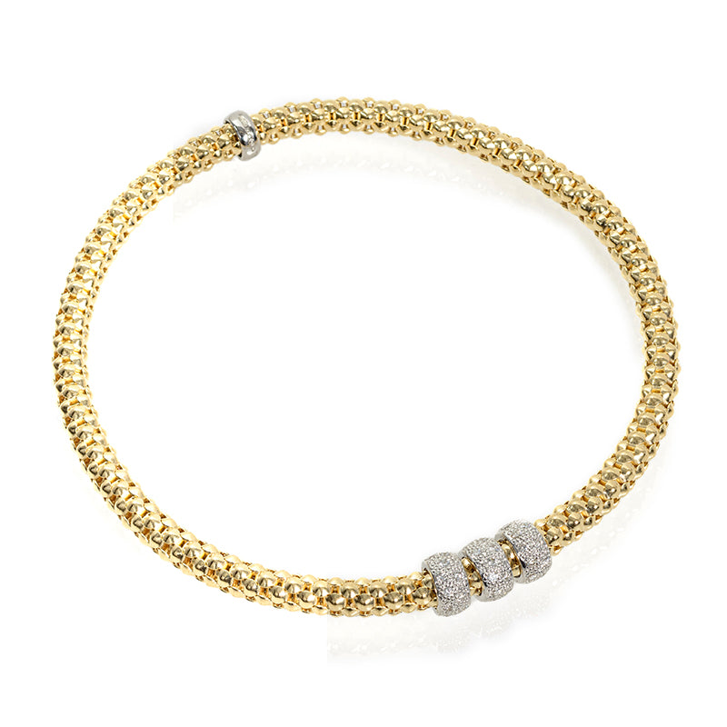 Indulge in luxury with the 18k Italian Gold Diamond Bracelet from our Stella Millano Italian Jewelry collection. Crafted with 18k Italian white and yellow gold, this one size fits all stretchable bracelet features 2 white gold solid rondels an one diamond rondel 0.09 cts and a stylish mesh design. Elevate your look with our stunning Rockstar collection.