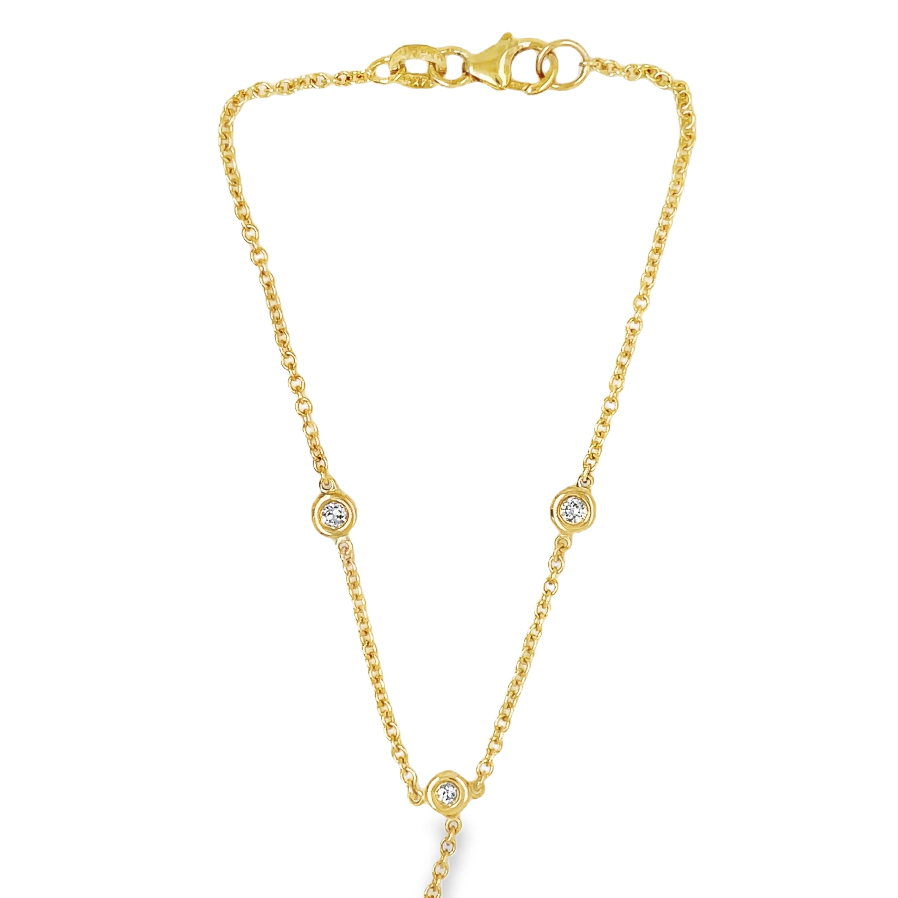 is exquisite hand chain is expertly crafted in Italy from 14k yellow gold and features five stunning diamonds, each individually bezel set for added security. The 1.3 mm thickness chain is both elegant and durable, while the secure lobster clasp ensures a perfect fit. Elevate your look with this hand-made, luxurious piece.