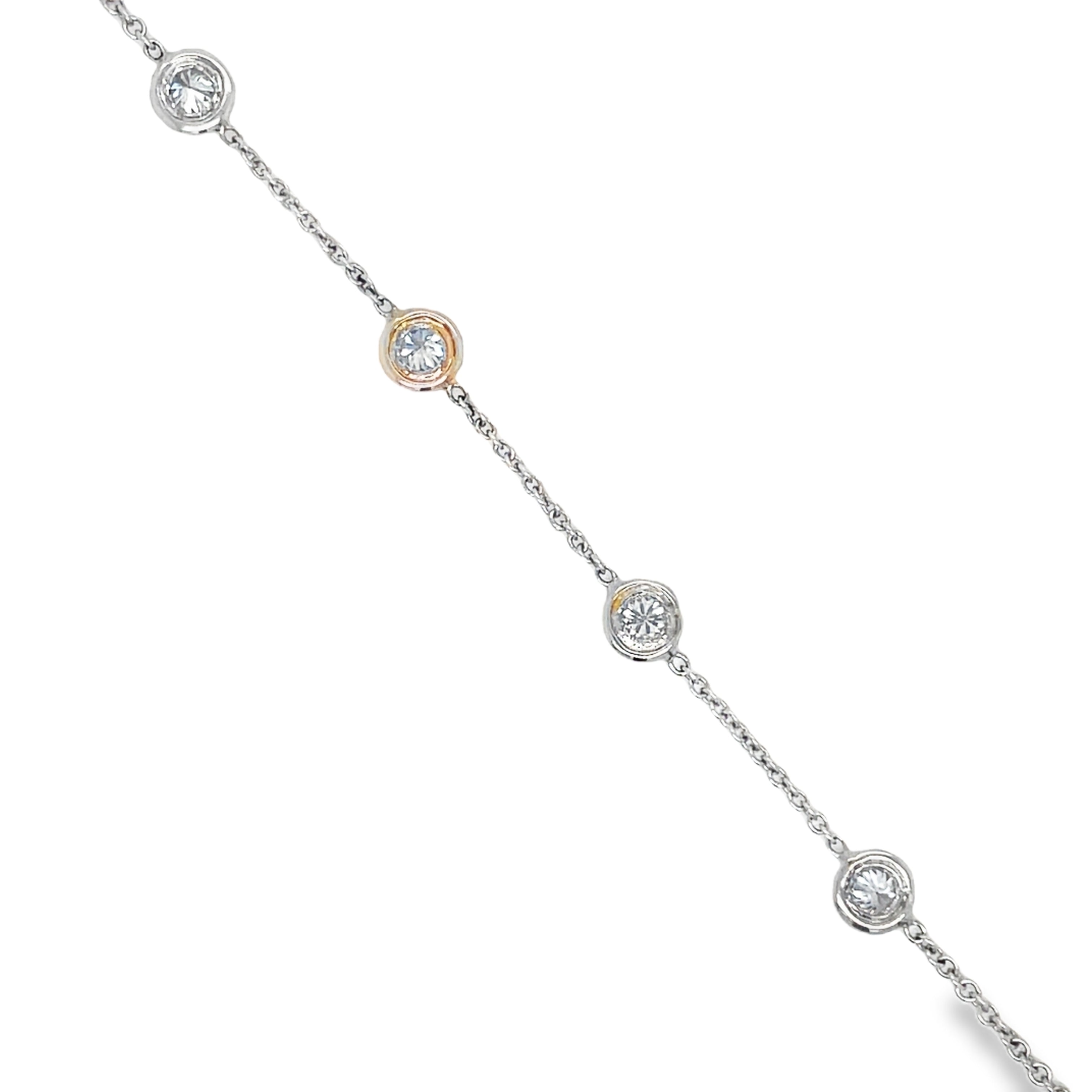 his exquisite Diamond By The Yard Bracelet features 14k white gold and four round diamonds totaling 0.60 cts. Each diamond is bezel set, adding a unique touch to this elegant piece. The secure lobster clasp ensures this bracelet stays in place, making it a luxurious and practical choice for any occasion.