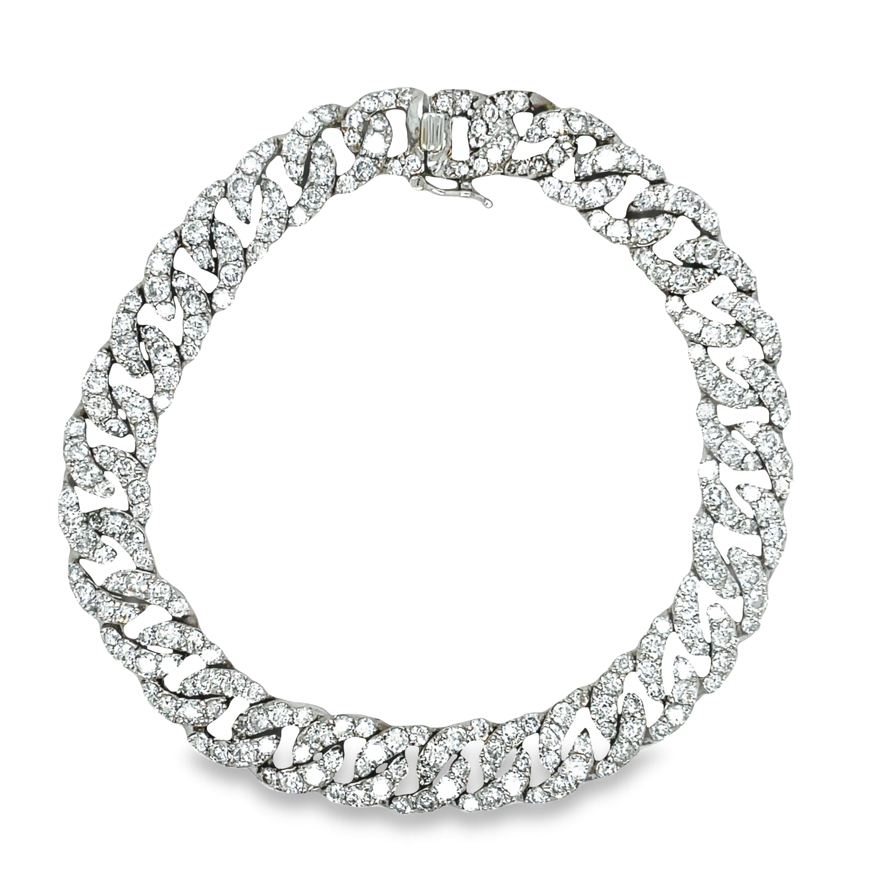 This 18k white gold chain link diamond bracelet features 7.58 carats of round diamonds for sparkle and shine. The bracelet is 7 1/4" long and features a hidden clasp for security and a classic curb link design.