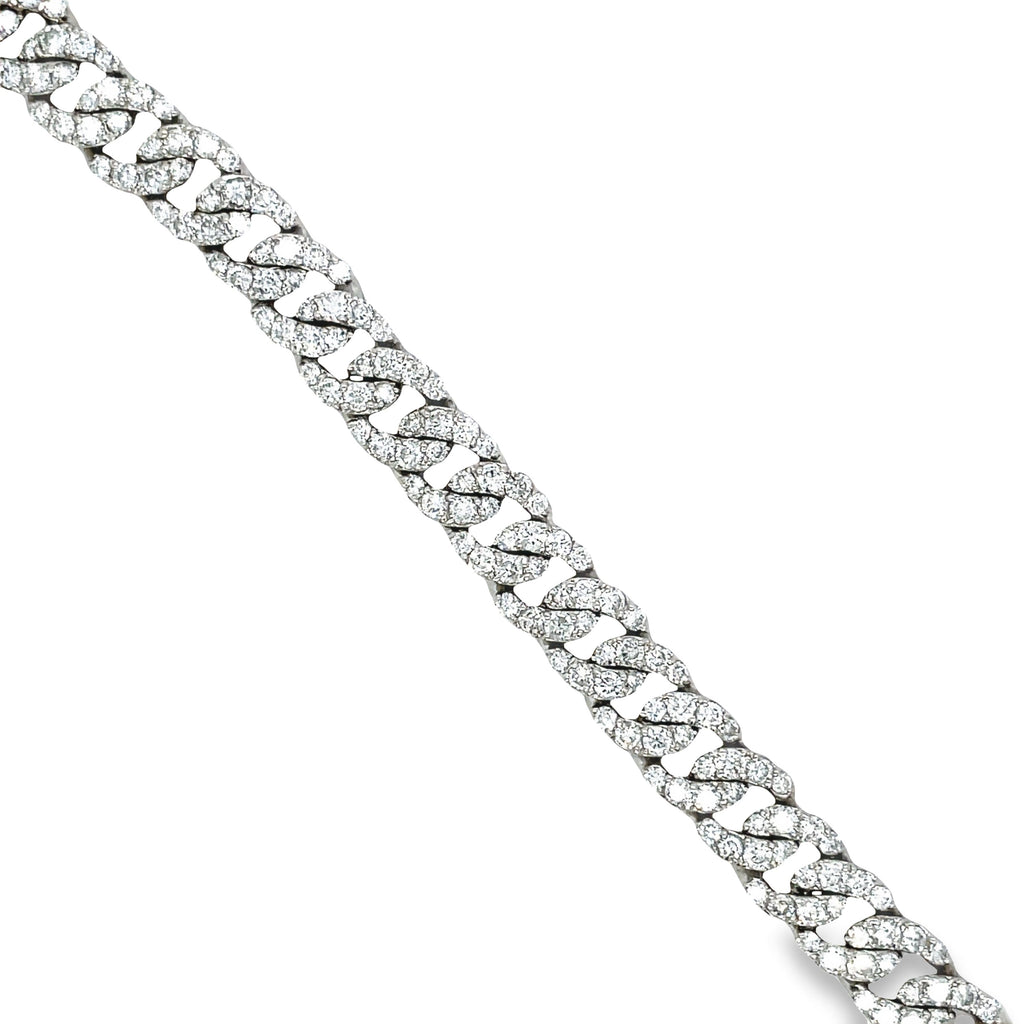 This 18k white gold chain link diamond bracelet features 7.58 carats of round diamonds for sparkle and shine. The bracelet is 7 1/4" long and features a hidden clasp for security and a classic curb link design.