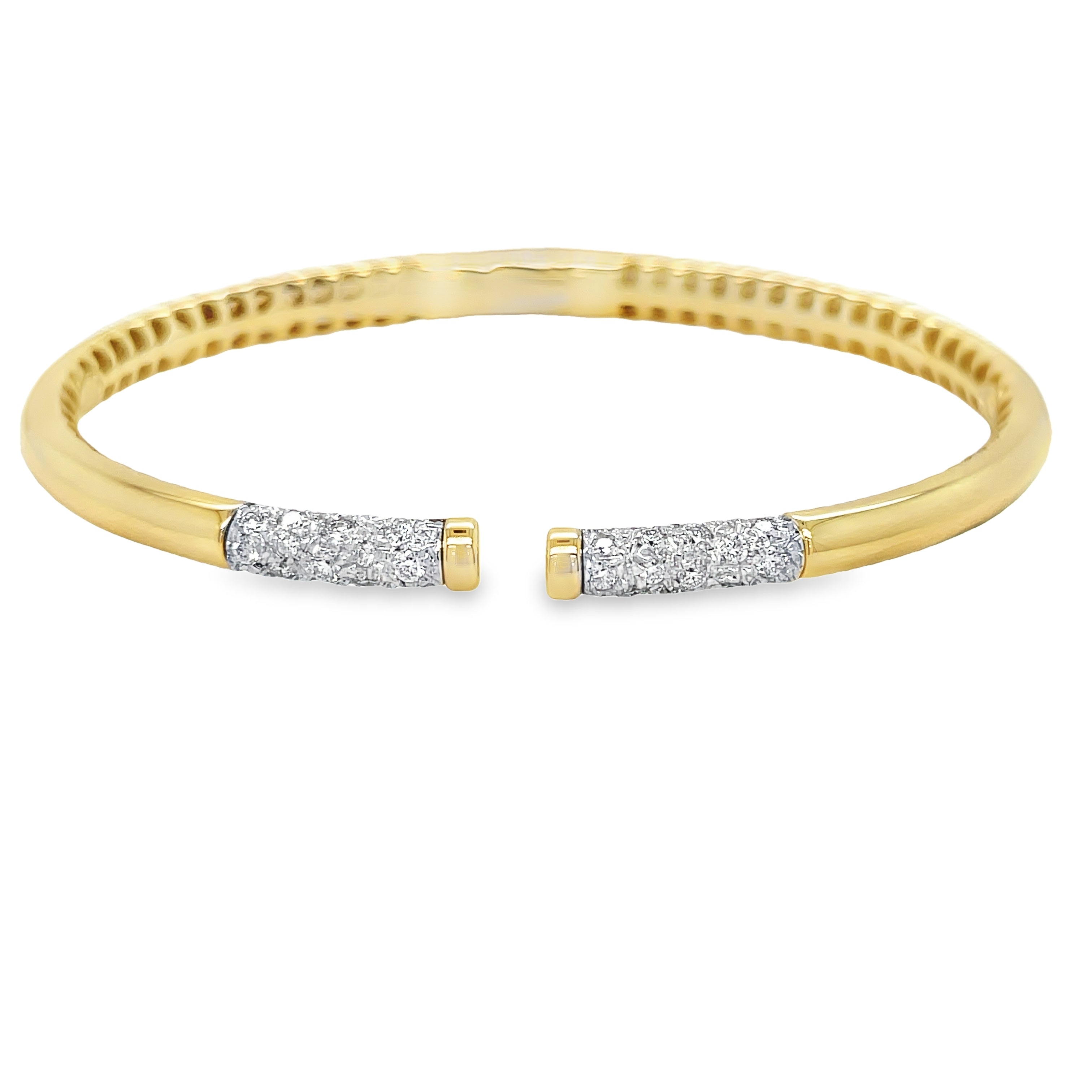 Elevate your accessory game with our 14k Italian Yellow Gold Diamond Bangle Bracelet. Crafted in Italy, this piece showcases a hinged system for easy wear and dazzling round diamonds 0.41 cts in an H/SI1 quality. Make a statement with our Veneroso Collection.