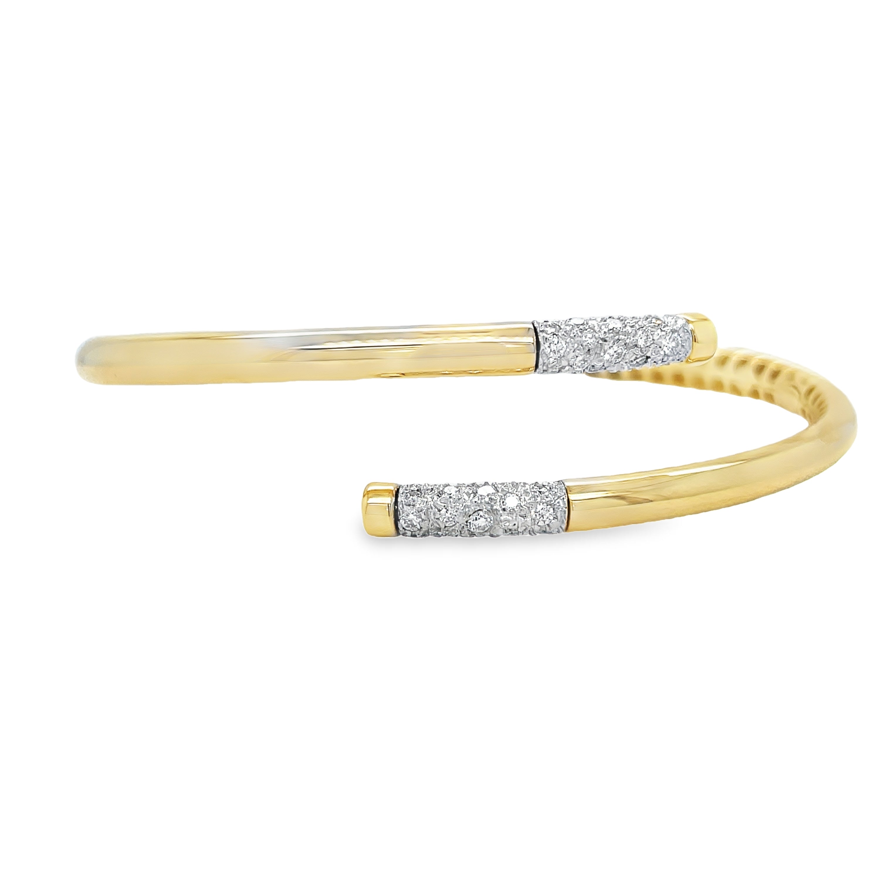 Elevate your accessory game with our 14k Italian Yellow Gold Diamond Bangle Bracelet. Crafted in Italy, this piece showcases a hinged system for easy wear and dazzling round diamonds cts in an H/SI1 quality. Make a statement with our Veneroso Collection.