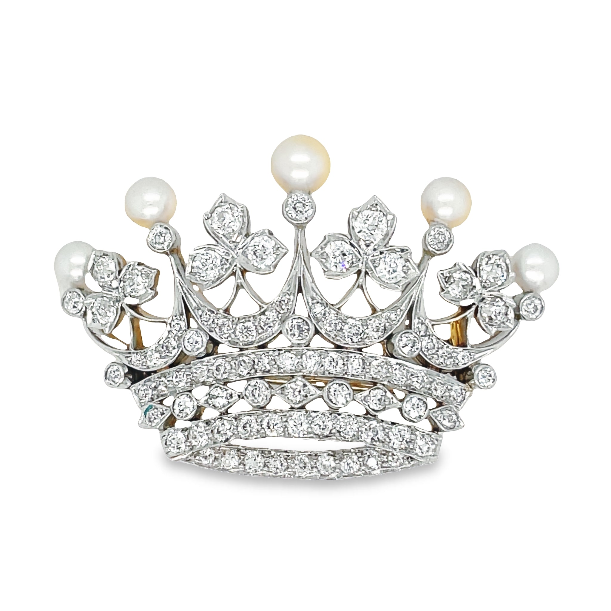 This magnificent Antique Diamond & Pearl Crown Brooch is crafted with exquisite platinum and 18k yellow gold, featuring five graduated cultured pearls and 5.80 cts of round diamonds. Every exquisite detail is sure to take your breath away!
