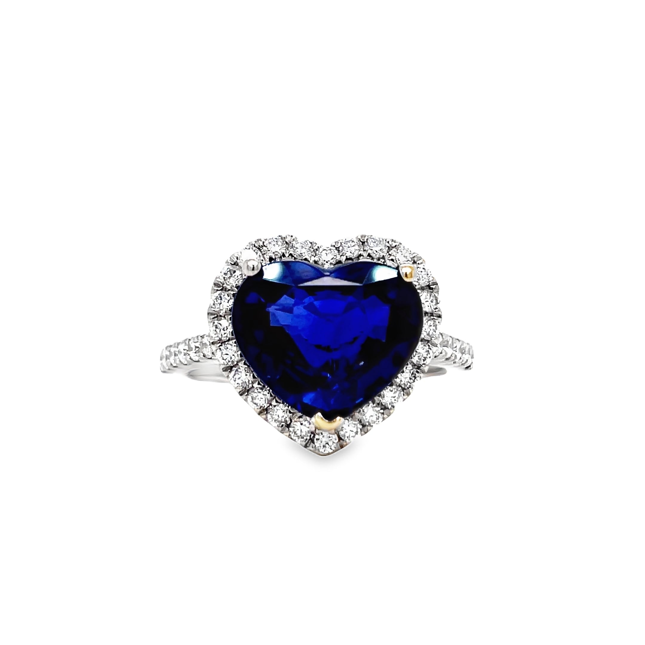 ndulge in the ultimate expression of love with our Heart Shape Sapphire and Diamond Ring. Crafted from 18k white gold, the centerpiece is a stunning 4.14 carat heart-shaped sapphire, surrounded by 0.42 carats of brilliant round diamonds. This unparalleled piece exudes elegance and luxury, making it a timeless addition to any jewelry collection.