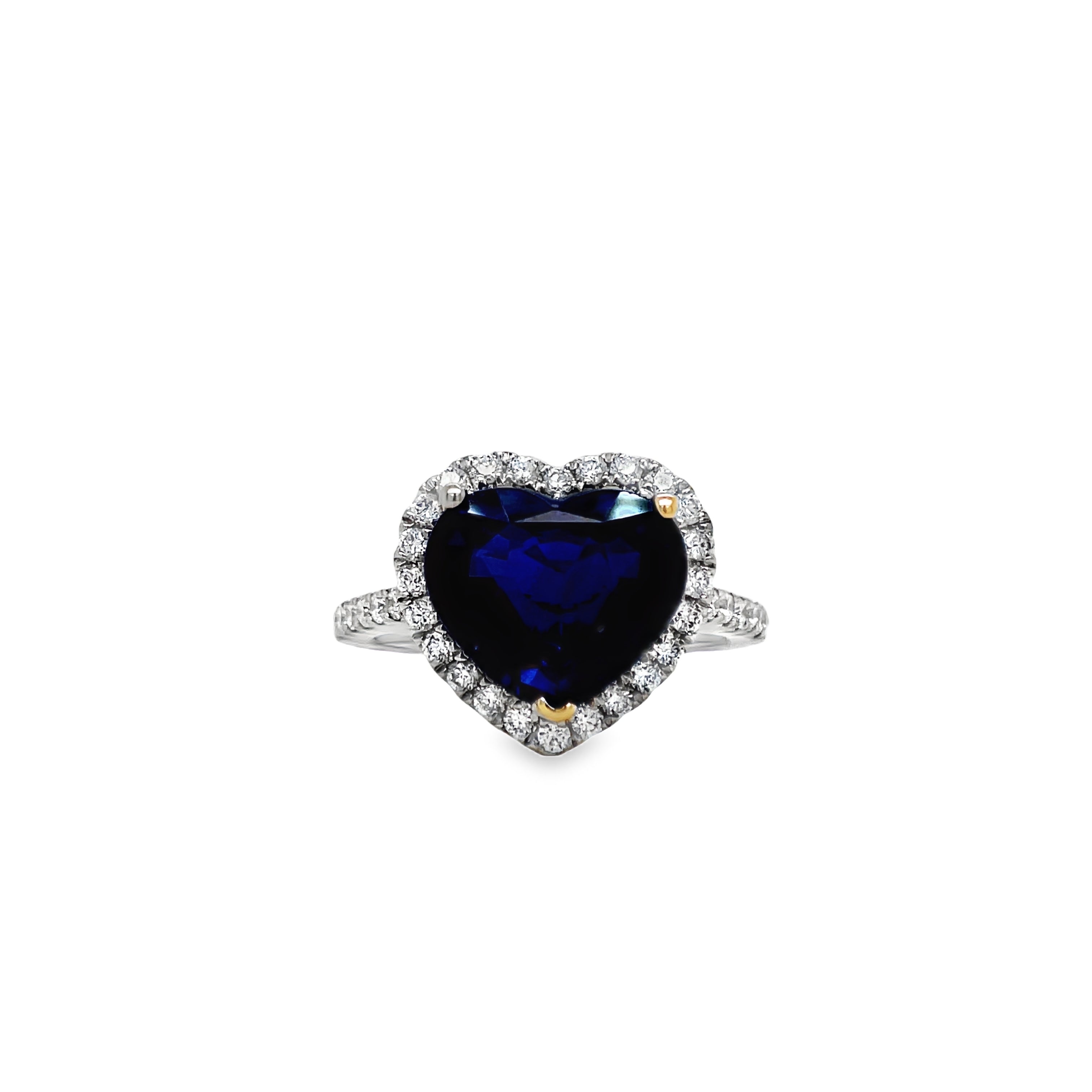 ndulge in the ultimate expression of love with our Heart Shape Sapphire and Diamond Ring. Crafted from 18k white gold, the centerpiece is a stunning 4.14 carat heart-shaped sapphire, surrounded by 0.42 carats of brilliant round diamonds. This unparalleled piece exudes elegance and luxury, making it a timeless addition to any jewelry collection.