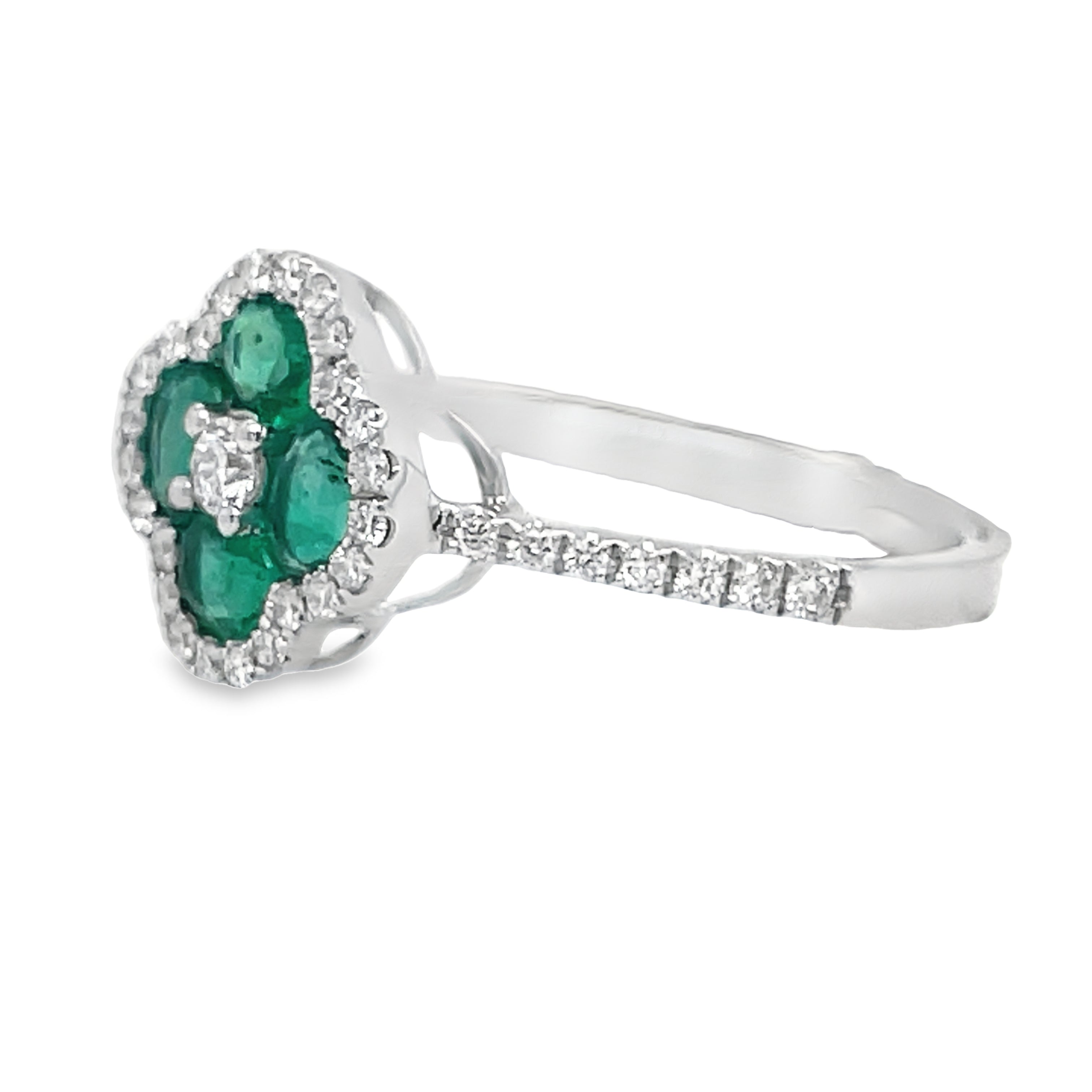 This elegant ring features a stunning floral design with a 14k yellow gold band, surrounded by sparkling white round diamonds totaling 0.25 carats. The centerpiece includes four round emeralds, totaling 0.70 carats and measuring 11mm in diameter. Add a touch of sophistication and luxury to any outfit with this beautiful piece.