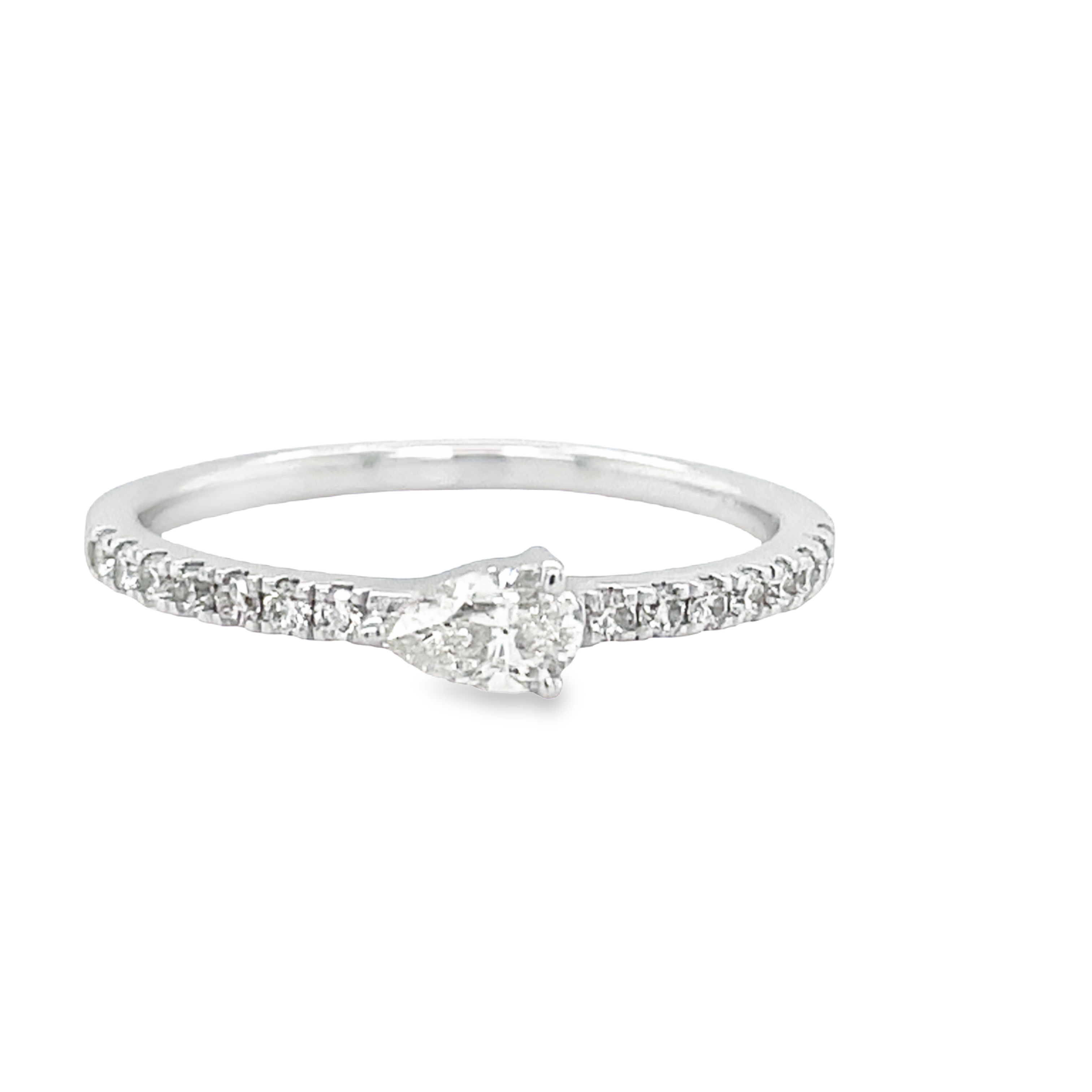 A breathtakingly beautiful ring, this dainty pear-cut (0.57 ct, East West facing) diamond is set in a 14 kt white gold band and surrounded by small sparkling diamonds. Exuding sophistication and glamour, this diamond ring is sure to add an eye-catching sparkle that will make your look timeless. 