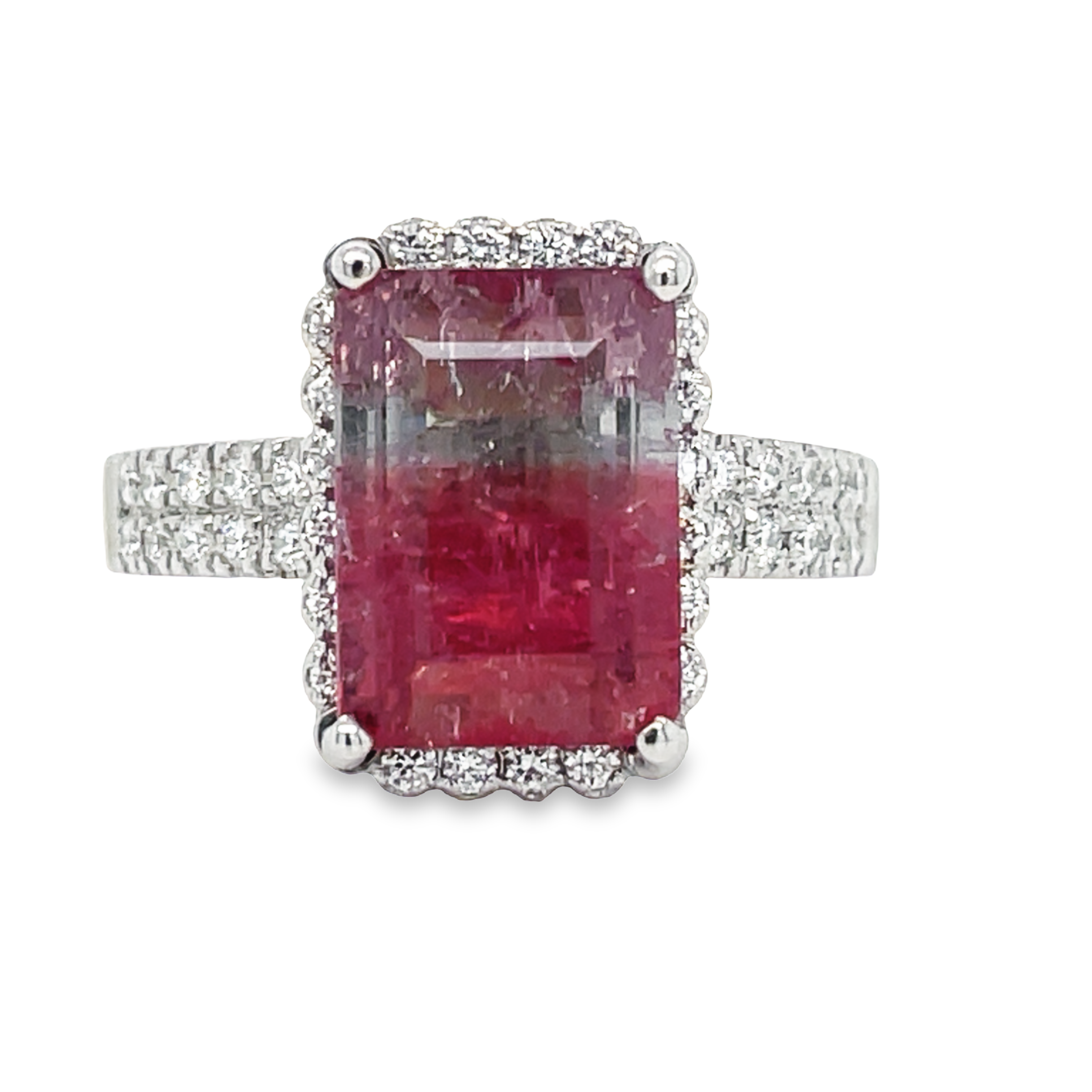 This exquisite pink tourmaline and diamond cocktail ring is crafted in-house with 14k white gold. The rectangular central tourmaline is complemented by a halo of 0.80 cts of diamonds, creating a unique look perfect for special occasions. An elegant and memorable piece of jewelry.