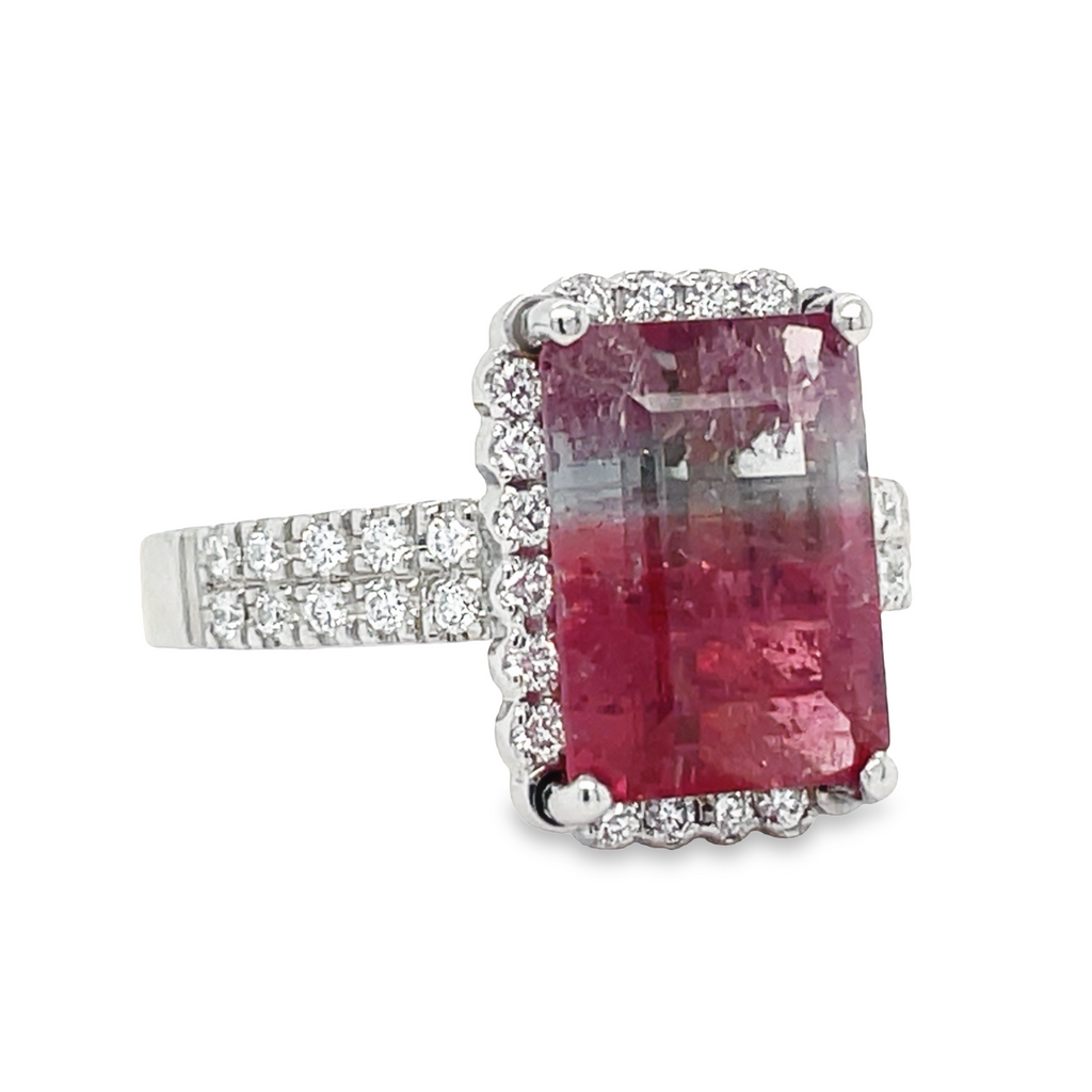 This stunning pink tourmaline and diamond cocktail ring is crafted in 14k white gold. It's set with a rectangular unique pink tourmaline centerpiece and accentuated by a brilliant halo of diamonds 0.80 cts for a truly unique look. Designed for special occasions, this sophisticated piece of jewelry will make a lasting impression.  This ring was made in our store
