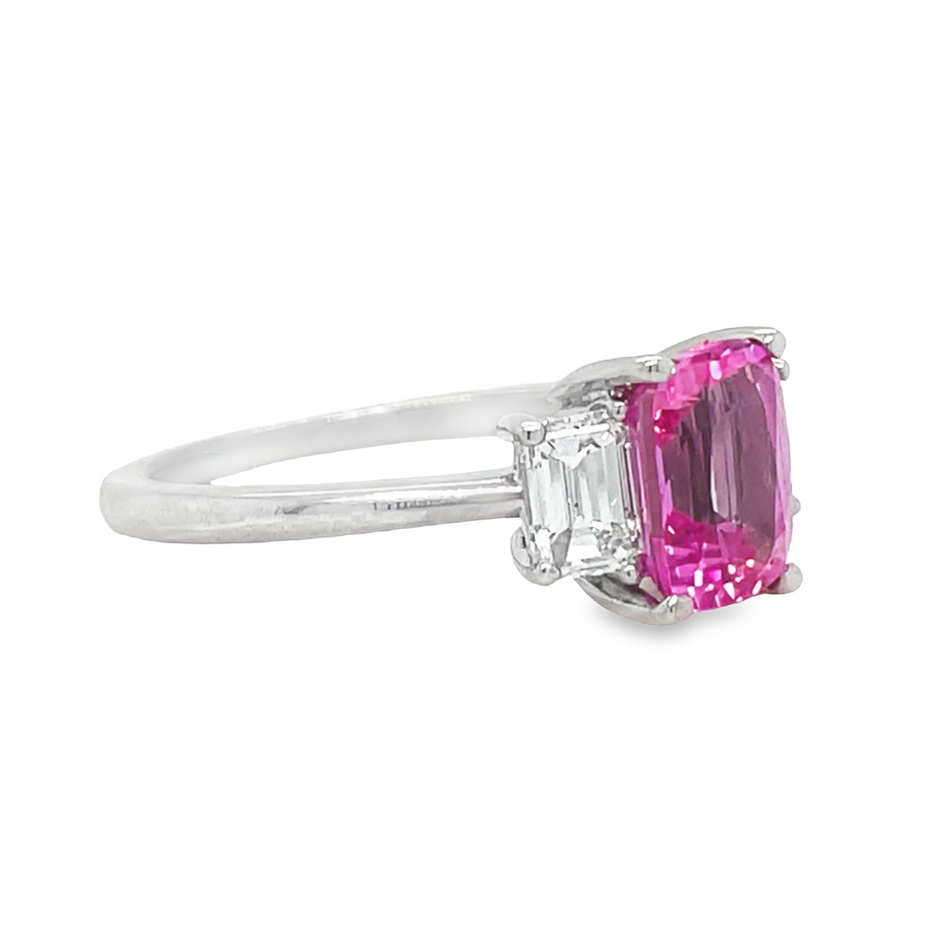 This gorgeous Emerald Cut Pink Sapphire 2.00 cts & Diamond Ring is crafted in quality platinum and set with two glittering emerald cut diamonds weighing 0.50 ct. Perfect for formal occasions, its exceptional sparkle and shine make it a timeless treasure.