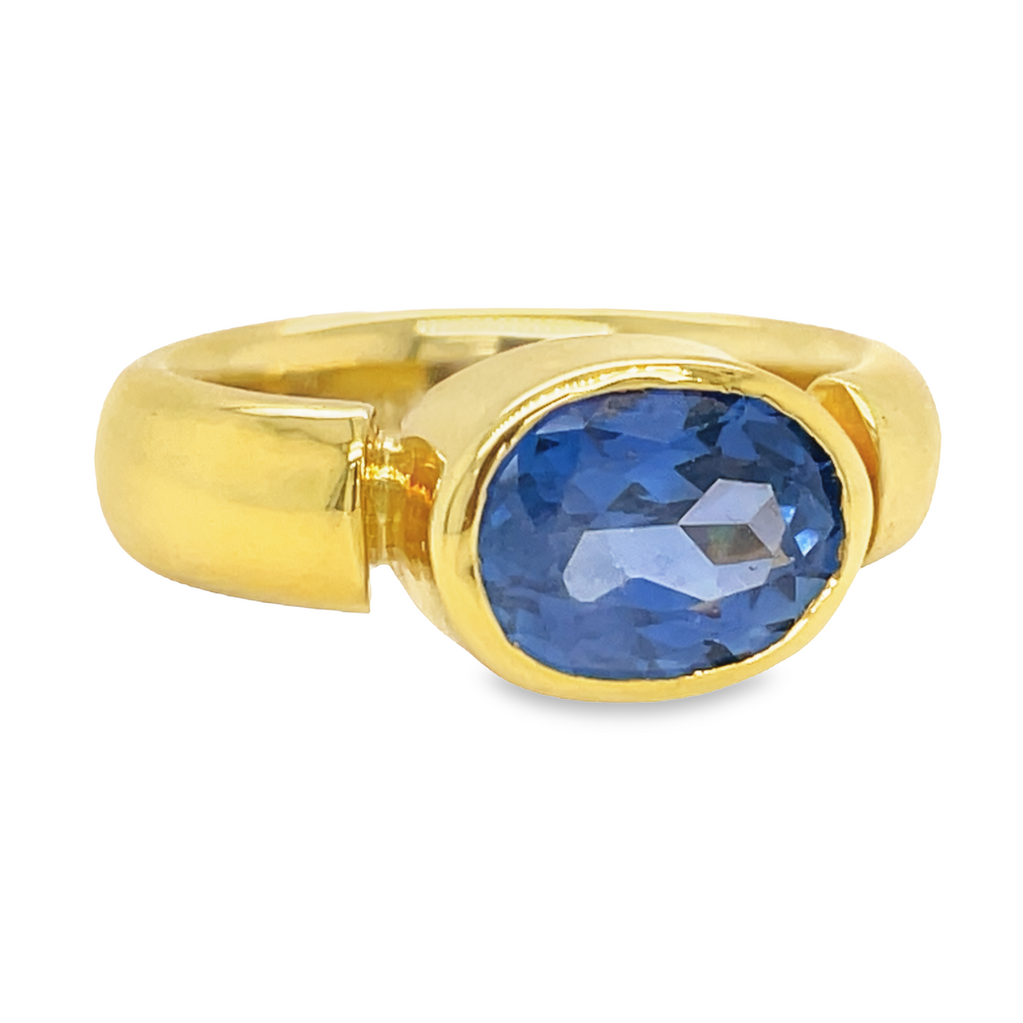 Custom made Oval Cut Sapphire Horizontal Gold Bezel Ring Side view 
