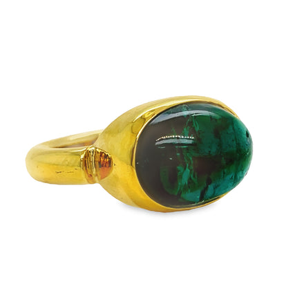 This stunning 18k yellow gold ring is an unforgettable statement piece. Its cabochon tourmaline stone is framed in a thick band, creating an effect that’s dramatic and luxurious. Its 4.50 cts of tourmaline stone will draw attention and admiration wherever you go. Make a bold statement today with this Blue Cabochon Tourmaline Chunky Gold Ring.