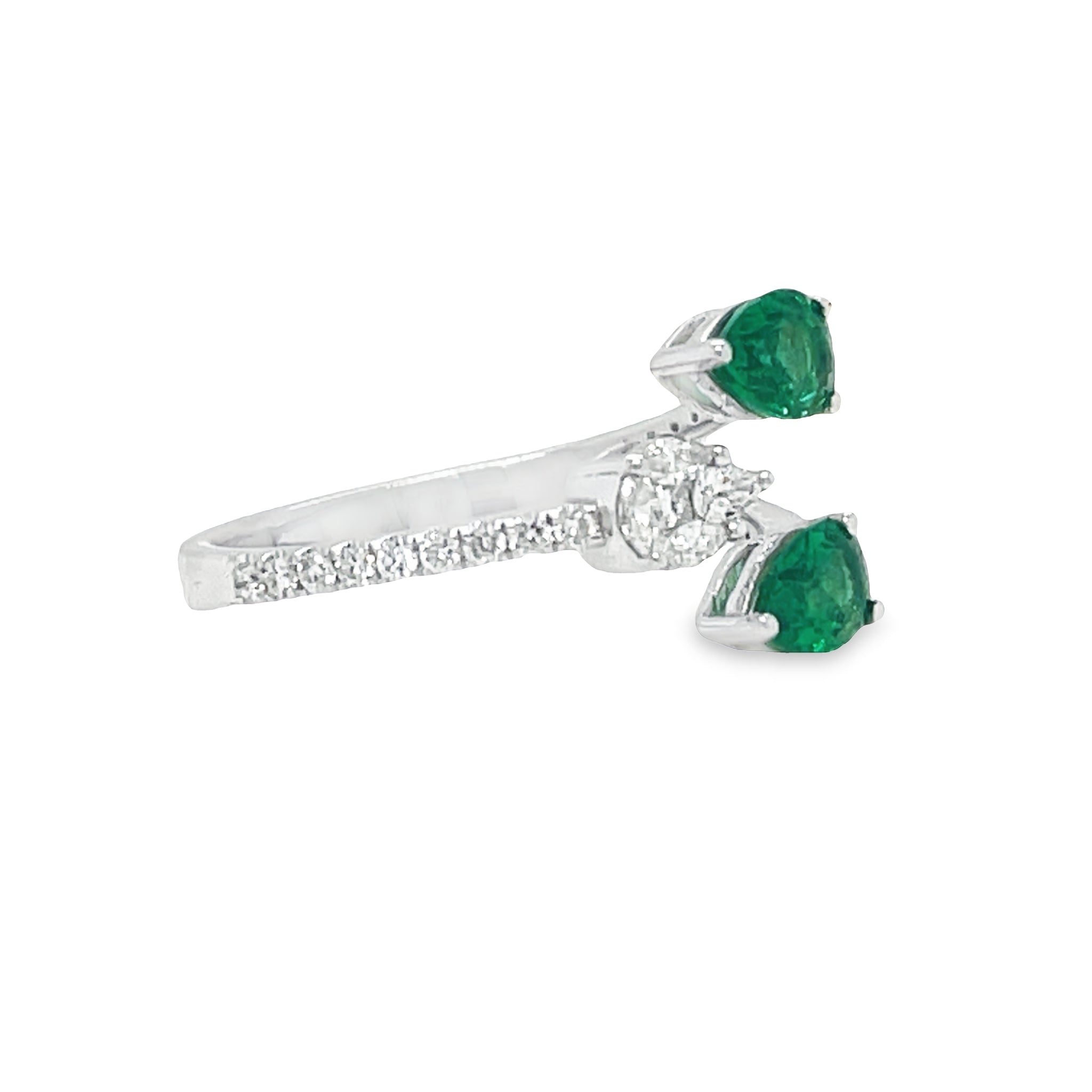 This elegant Pear Shape Emerald & Pear Shape Open Diamond Ring is the perfect accessory for any special occasion. Crafted with two pear emeralds 0.70 cts and one diamond pear shape 0.31 cts set in 18k white gold, this exquisite open ring will make an unforgettable statement. Make your mark with this stunning piece!