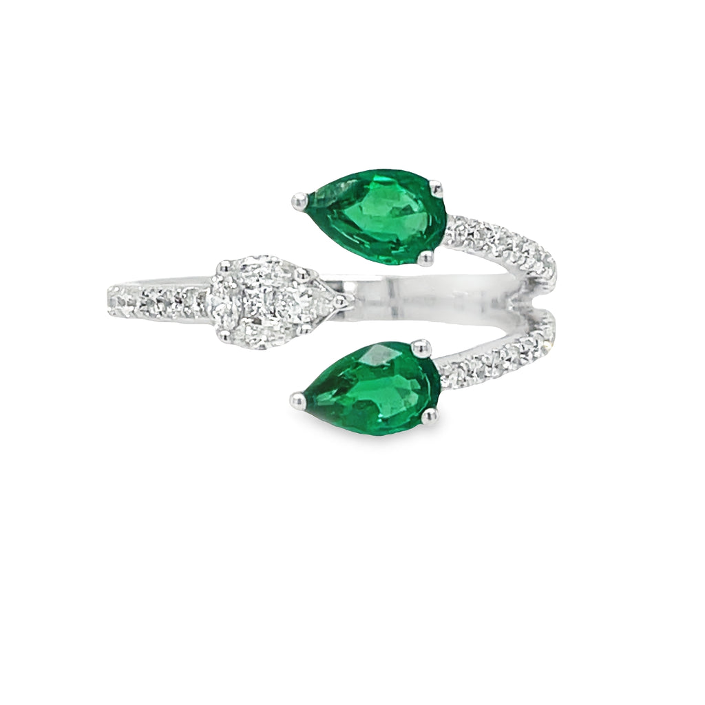 This elegant Pear Shape Emerald & Pear Shape Open Diamond Ring is the perfect accessory for any special occasion. Crafted with two pear emeralds 0.70 cts and one diamond pear shape 0.31 cts set in 18k white gold, this exquisite open ring will make an unforgettable statement. Make your mark with this stunning piece!