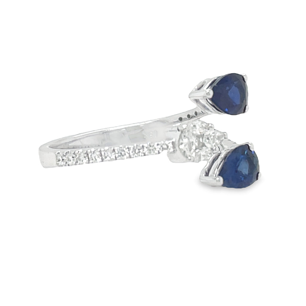 This elegant Pear Shape Sapphire & Pear Shape Open Diamond Ring is the perfect accessory for any special occasion. Crafted with two pear sapphires 1.11 cts and one diamond pear shape 0.34 cts set in 18k white gold, this exquisite open ring will make an unforgettable statement. Make your mark with this stunning piece!