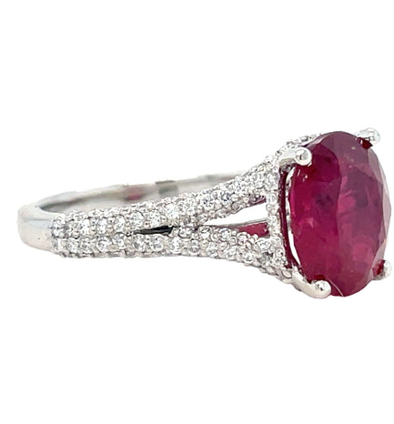 Adorn your hand with sophisticated glamour with our Oval Burmese Ruby and Diamond Ring. Crafted in platinum, the eye-catching centerpiece is a Burmese oval ruby of 2.58 carats, beautifully framed by 1.20 carats of dazzling round diamonds. Experience timeless elegance with this exquisite piece.
