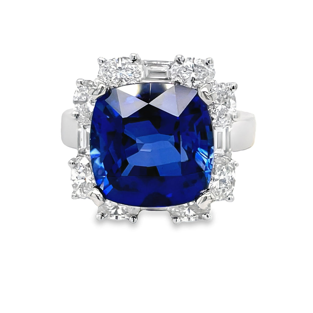 Step into elegance with our Cushion Cut Tanzanite & Diamond Cocktail Ring. Featuring a stunning 9.20 carat cushion cut tanzanite stone, accented by 8 oval diamonds 1.28 cts and 4 baguette diamonds 0.54 cts. Set in luxurious 18k white gold. Elevate your style and make a statement with this exquisite ring.