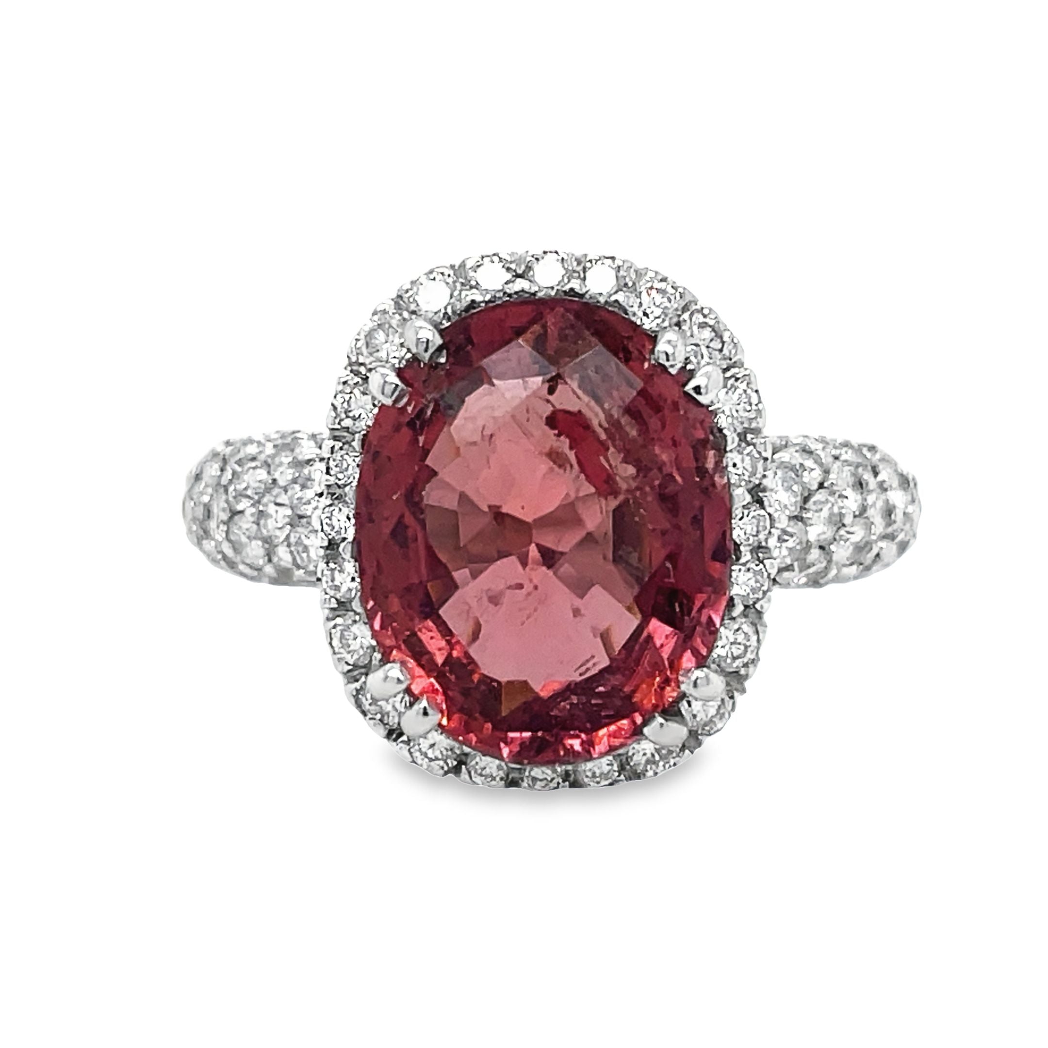Expertly crafted with a 4.47 carat oval tourmaline and 1.15 carats of diamond pave set in 18k white gold, this ring exudes elegance and luxury. Add a pop of color and sparkle to any outfit with this one-of-a-kind piece.