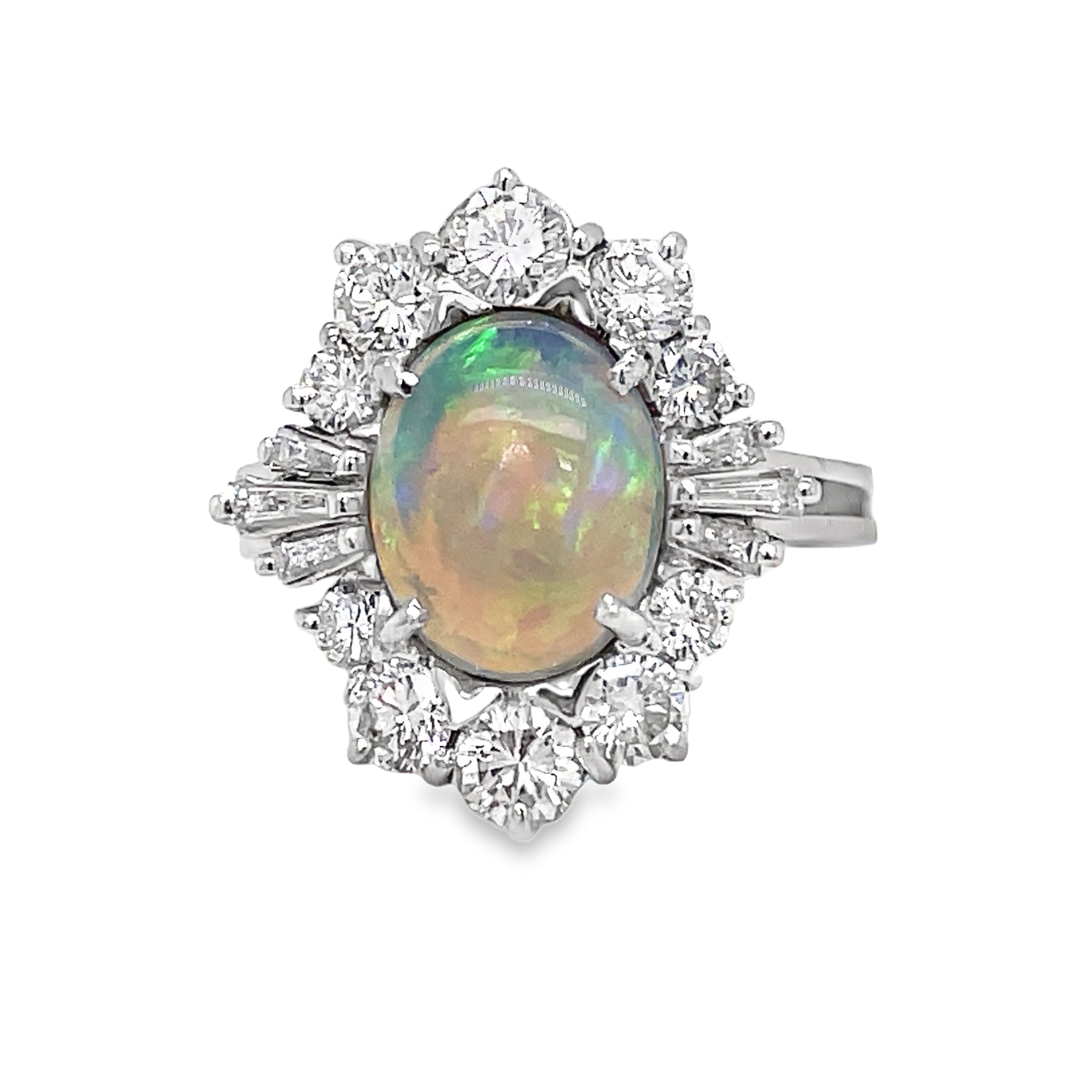 his Estate Diamond Opal Ring exudes elegance and luxury. Crafted in 14k white gold, it features a stunning round opal and 1.10 carats of sparkling round diamonds. A timeless piece that adds sophistication to any outfit. Own a piece of art for your finger.