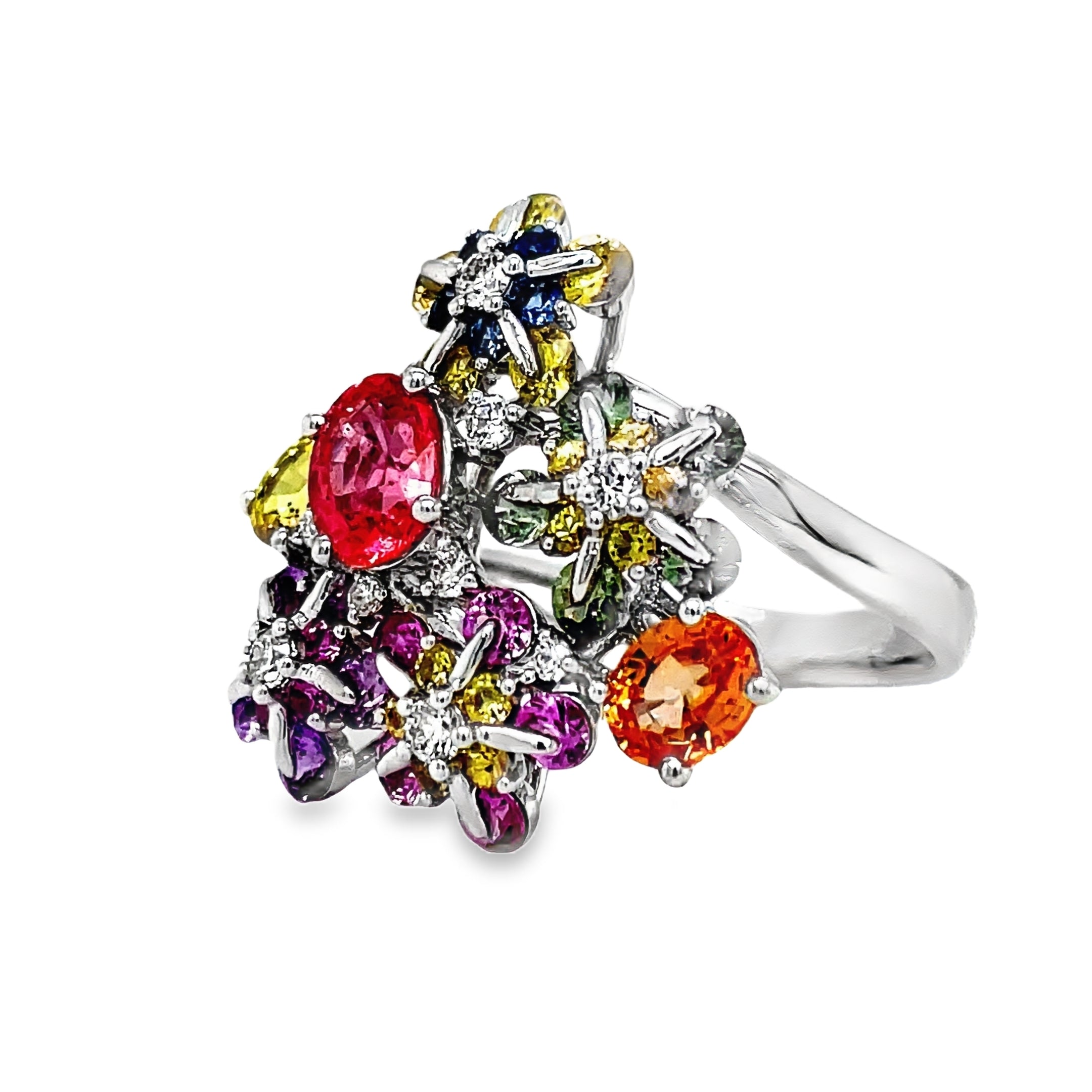 Indulge in the delicate beauty of our Multicolor Sapphire &amp; Diamond Flower Motif Ring. Adorned with 3.22 carats of multicolored sapphire stones and 0.17 carats of round diamonds, this flower-inspired ring exudes elegance and sophistication. Crafted with 18k white gold, it is a true masterpiece of refined luxury.